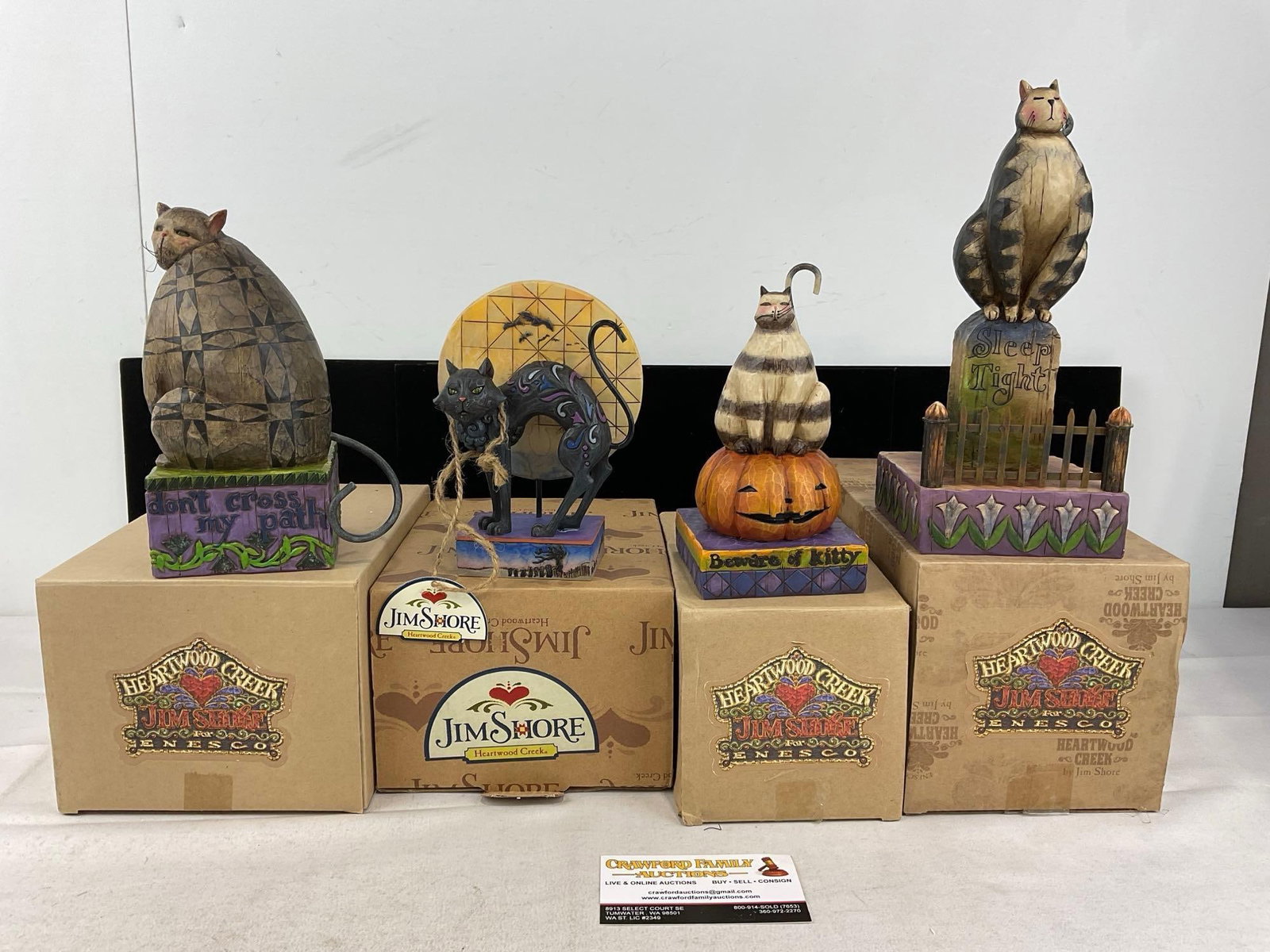 4 Jim Shore Heartwood Creek Halloween Cat Figures, in boxes, names in desc: Includes: Dont Cross My Path #117679, Beware of Kitty #118100, Sleep Tight #118101, & Bad Luck #4011059. Appears to be in good shape, only lightly used. The piece measures approx 12h x 10w