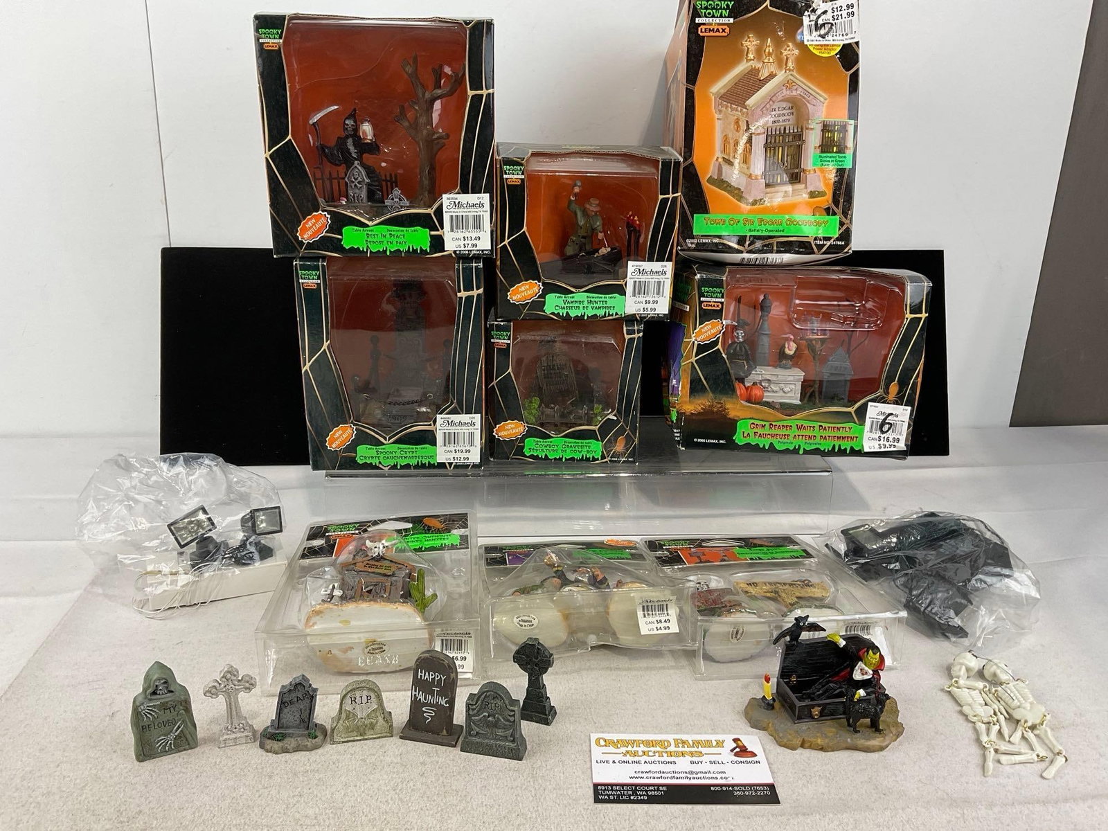 Lemax Spooky Town Halloween pieces, 6 in box, & Figures, in packaging: Rest in Peace, Spooky Crypt, Vampire Hunter, Cowboy Gravesite, Tomb of Sir Edgar Goodbody, & Grim Reaper Waits Patiently. Appears to be in good shape, only lightly used. The piece measures approx