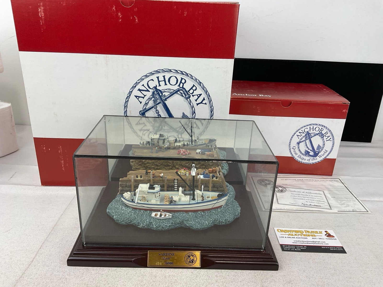 Anchor Bay Collectible, in pair of boxes, Sardine Lori #494/4000, w/COA, Resin Boat & Dock Scene: Appears to be in fair to good shape, some wear. The pieces fit in a box that measures approx 20h x 14w x 10d inches. See pics. E-6120