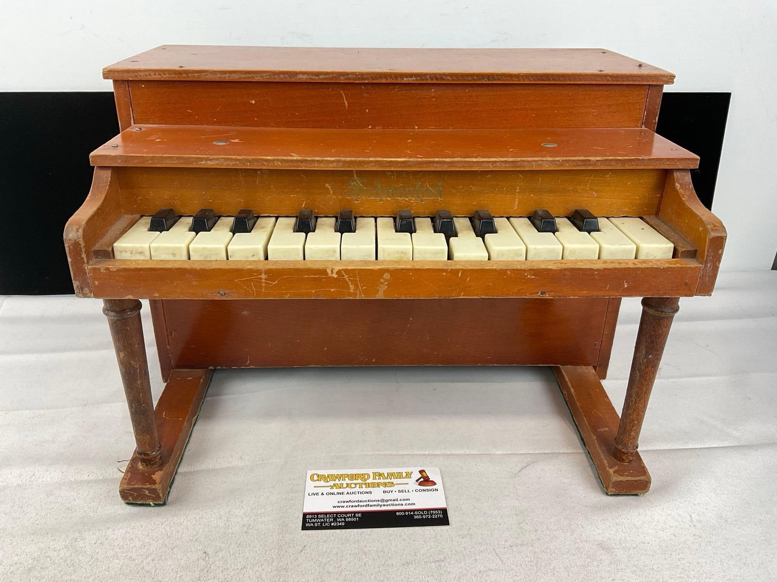 Vintage Schoenhut Toy Piano, 11x15x11 inches, Chime tone: Appears to be in fair good shape, has some surface scratches, one key sticks a bit. The piece measures approx 11h x 15w x 11d inches. See pics. E-6160