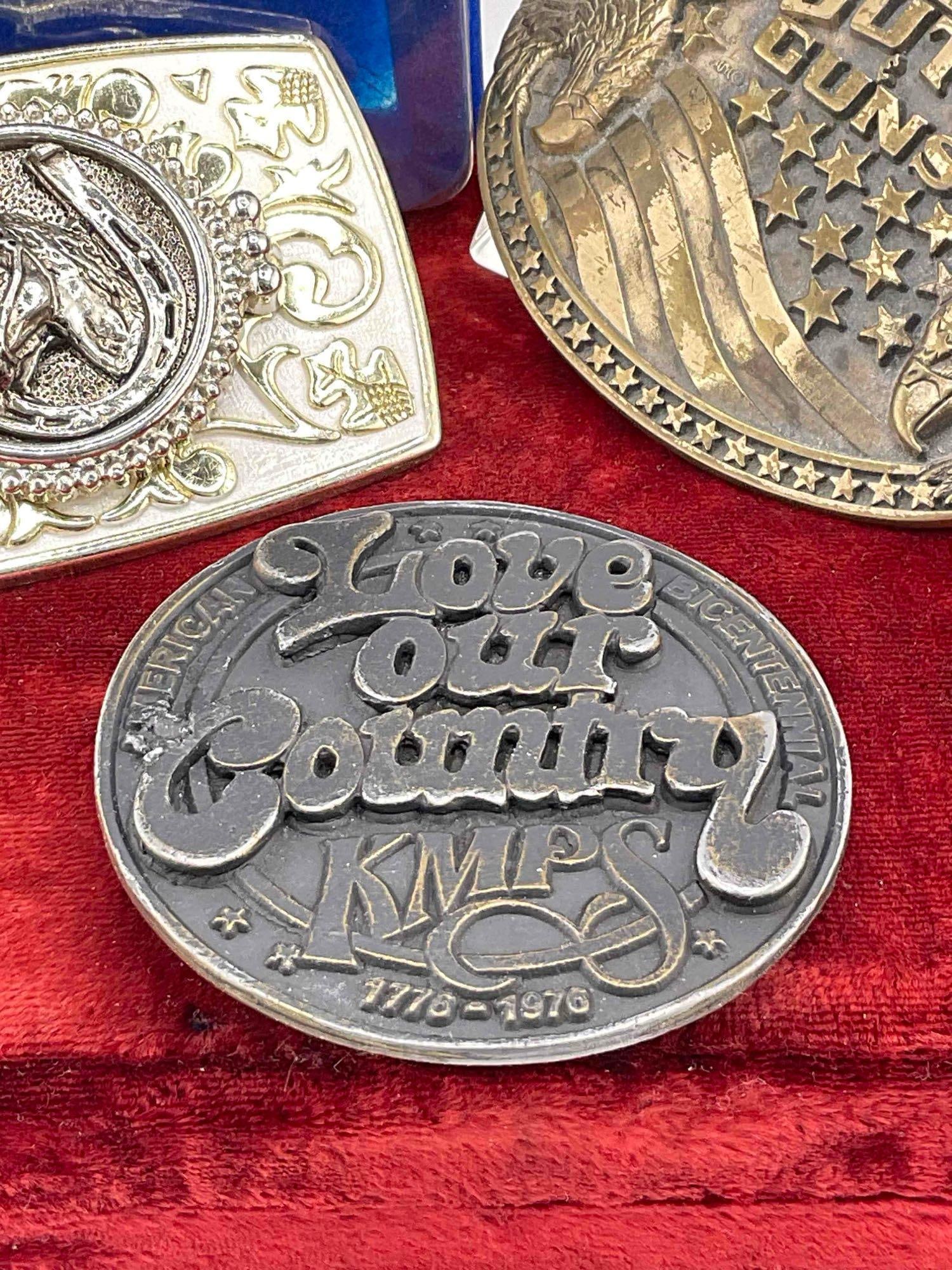 3 x buckles, lucky horseshoe, bicentennial KMPS radio, God, guts, & guns - 3
