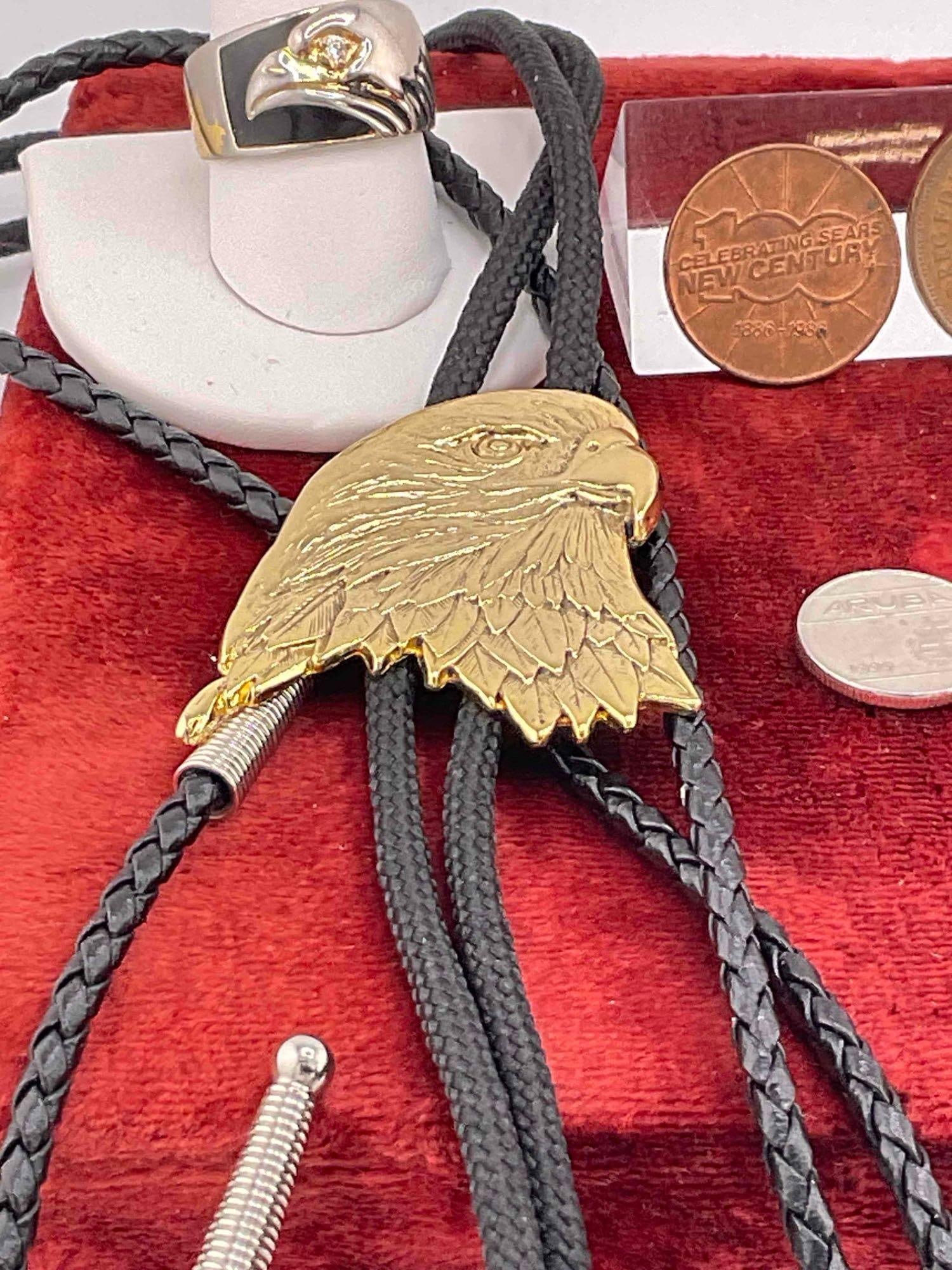 assortment of foreign coins, two eagle themed bolo ties, Eagle ring, two lighters - 3