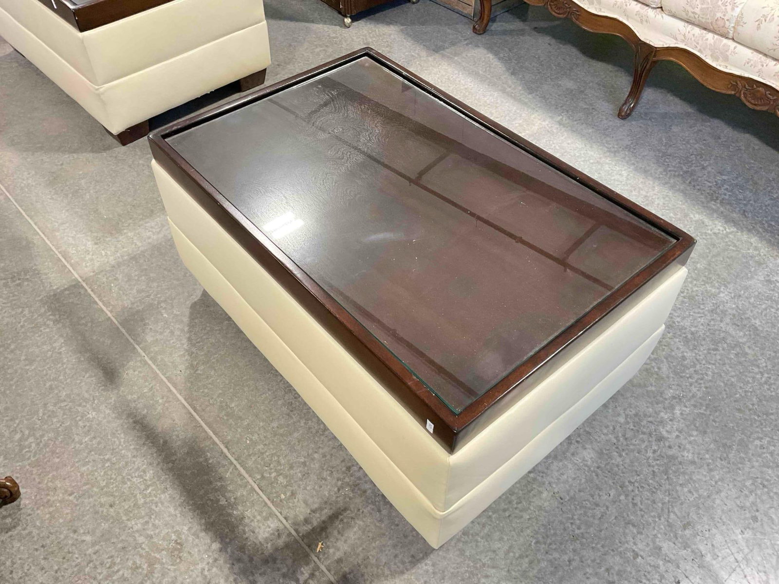 Modern Glass Topped Coffee Table w/ Wood & Cream Vinyl Base. Measures 35" x 23" x 17" - 3