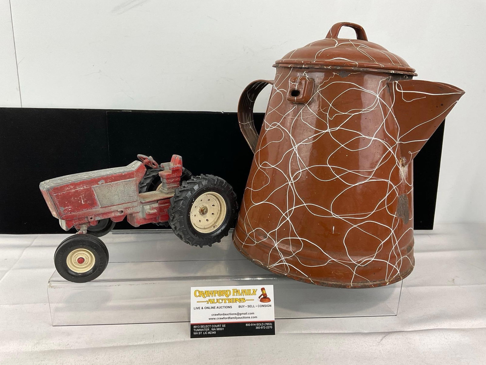 Vintage Diecast Ertl International Harvester 3088 Tractor & Brown Enamelware Pitcher: Appears to be in fair to good shape, shows some wear. The piece measures approx 11h x 13w x 9d inches. See pics. E-5940