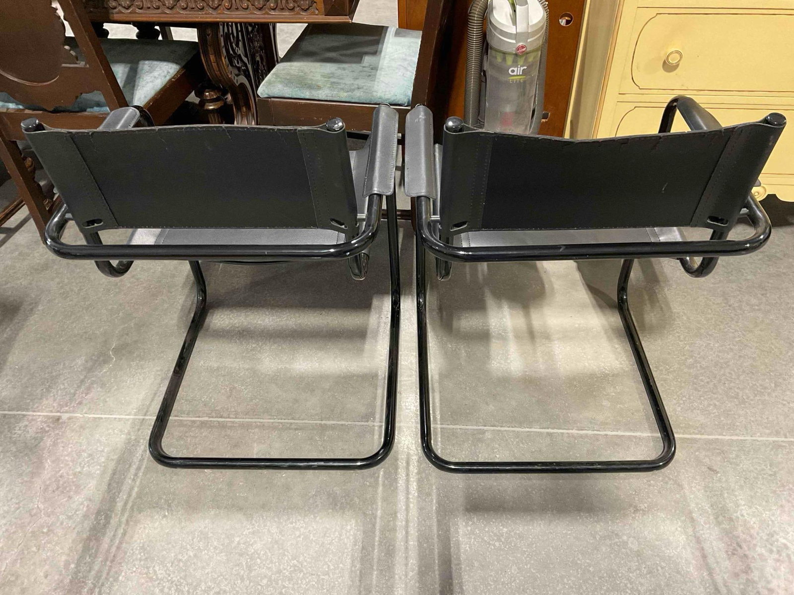 Pair of Black Metal & Faux Leather Cantilever Chairs. Fair Condition. Measures 24" x 21" x 32" - 6