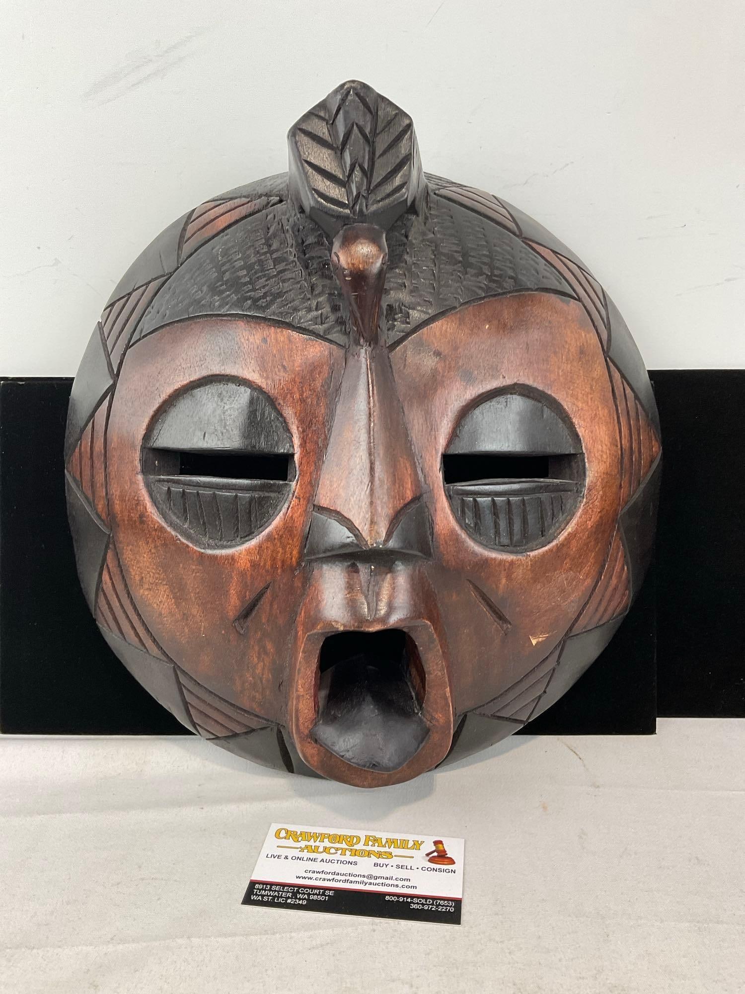 Ghanian Carved Wooden Mask, Dark & Lighter Wooden Features, 16x13wx 5 inches: Appears to be in good shape. The piece measures approx 14h x 13w x 5d inches. See pics. E-6230
