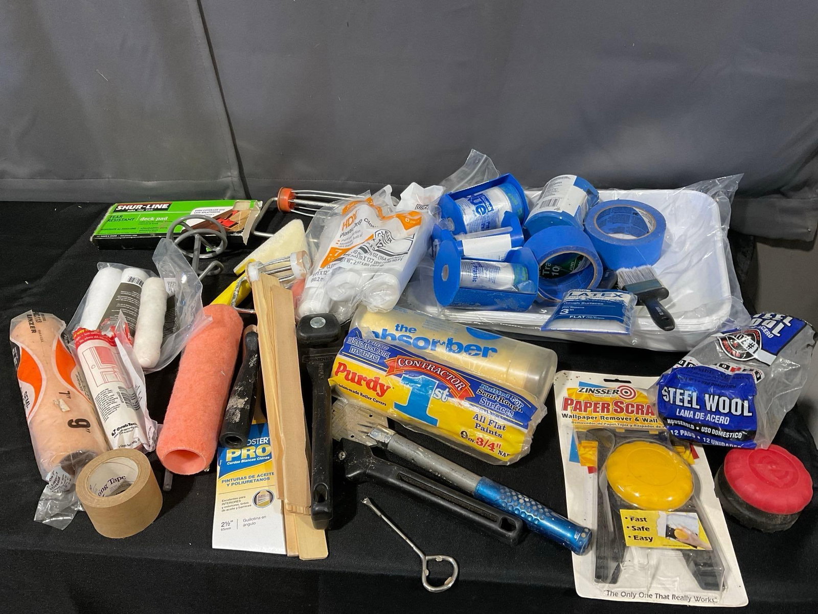 Tub of Painting Supplies, Rollers, Scrapers, Tape, Steel Wool, Paint Stirrer, & more: Appears to be in good shape. The piece measures approx 13h x 23w x 17d inches. See pics. E-6340 *Oversized shipping may apply*