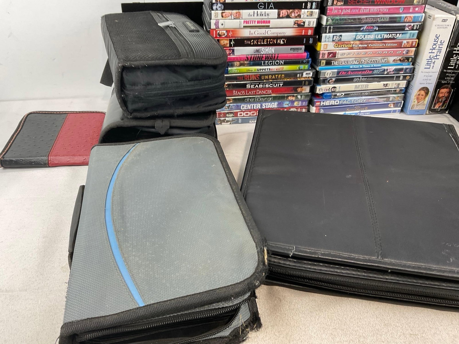 Collection of DVDs, 55+ w/cases, 100-200+ in the soft cases - 4