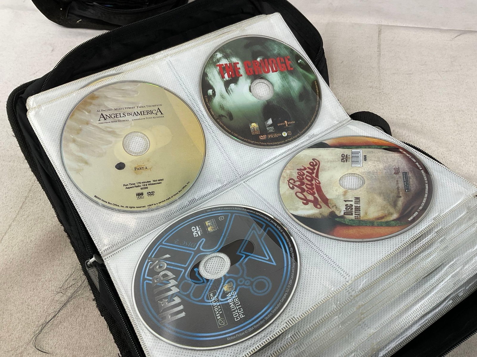 Collection of DVDs, 55+ w/cases, 100-200+ in the soft cases - 7