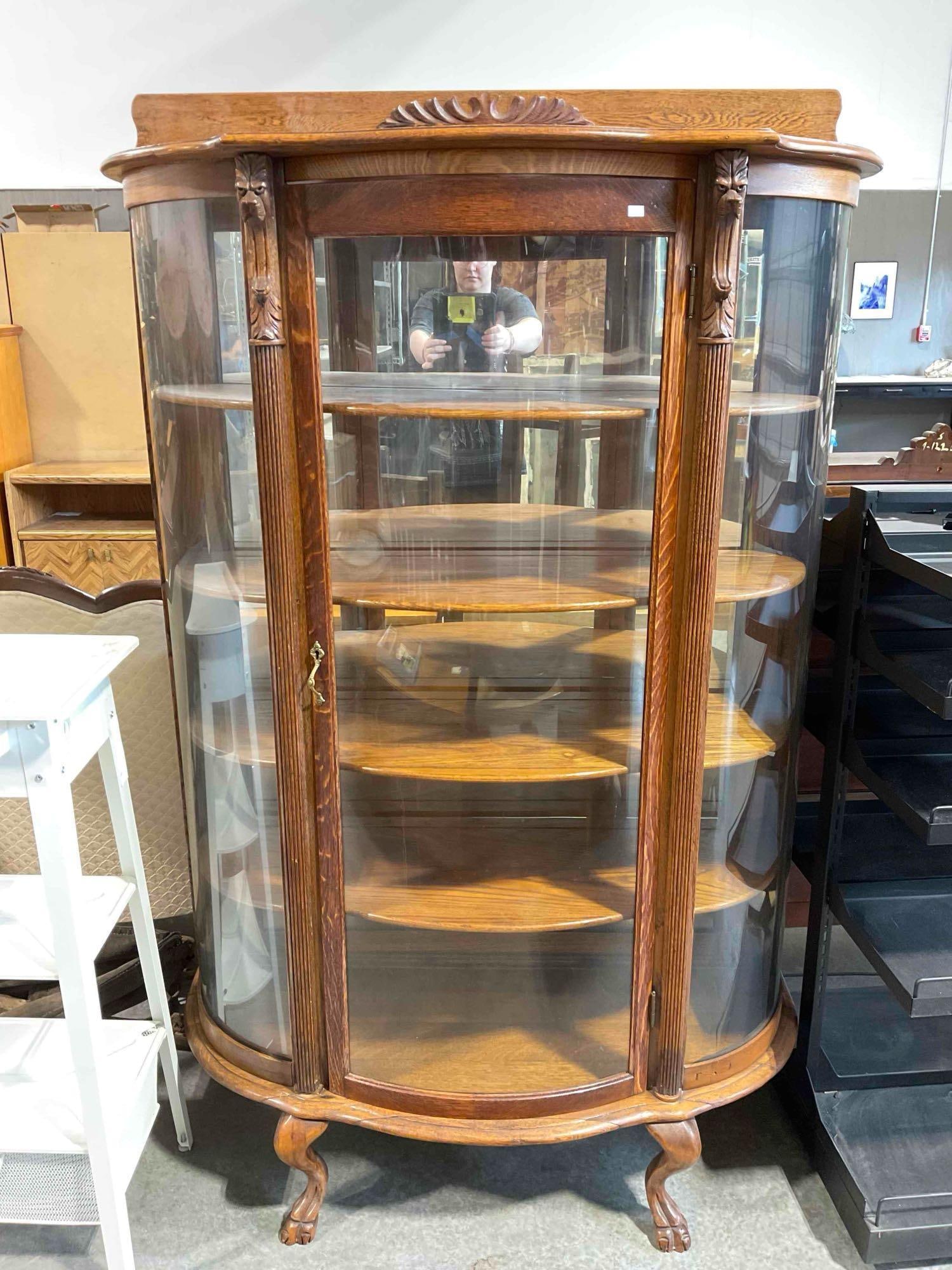 Antique Handsome Tiger Oak 4-Tier Curved Glass Curio Case w/ Lion Details. Good Condition.