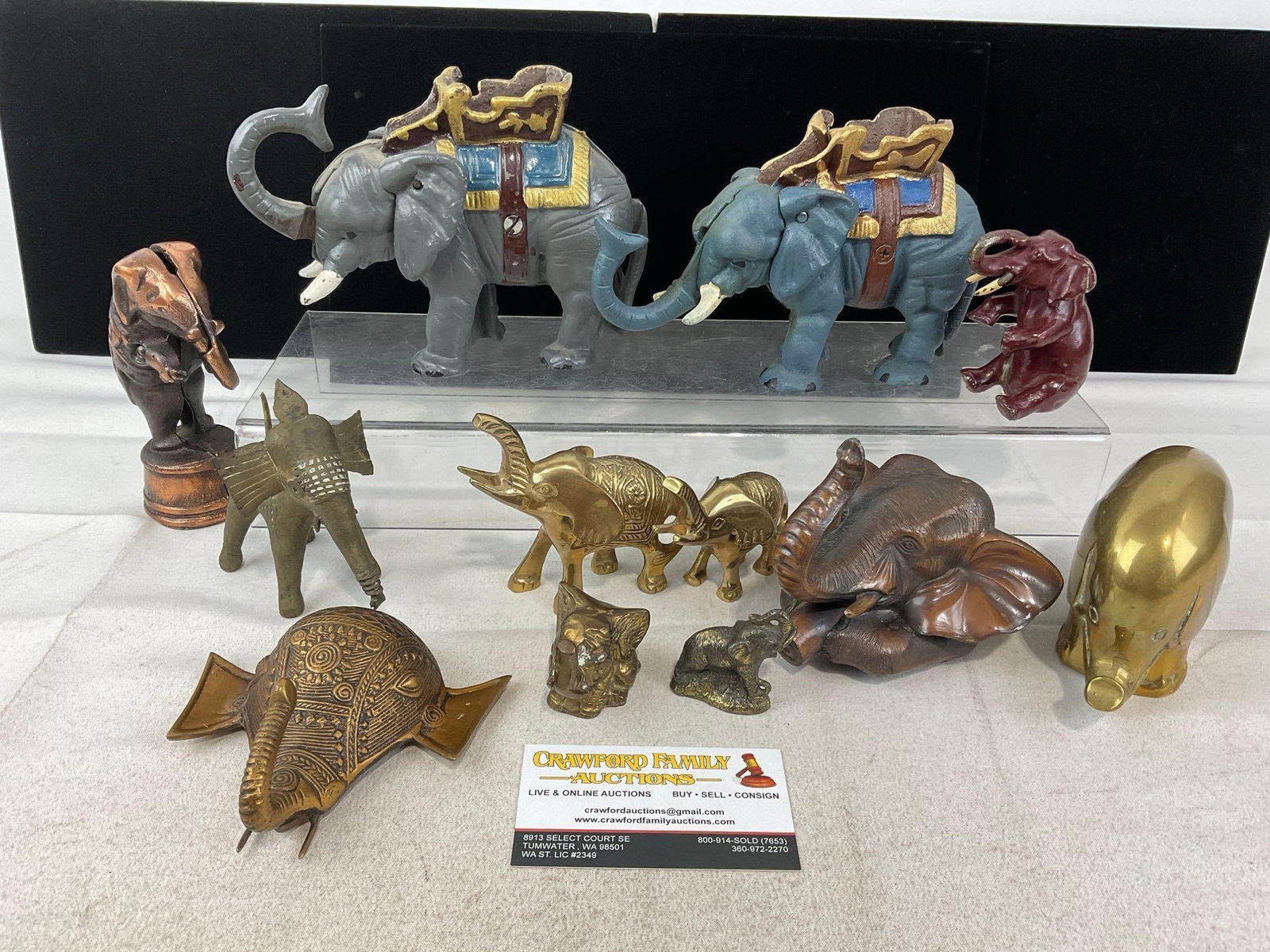 Handpainted Elephant Figural Cast Iron Banks, Brass, Copper Tone Metal, & more: Appears to be in good shape. The piece measures approx 5h x 16w x 22d inches. See pics. E-6230