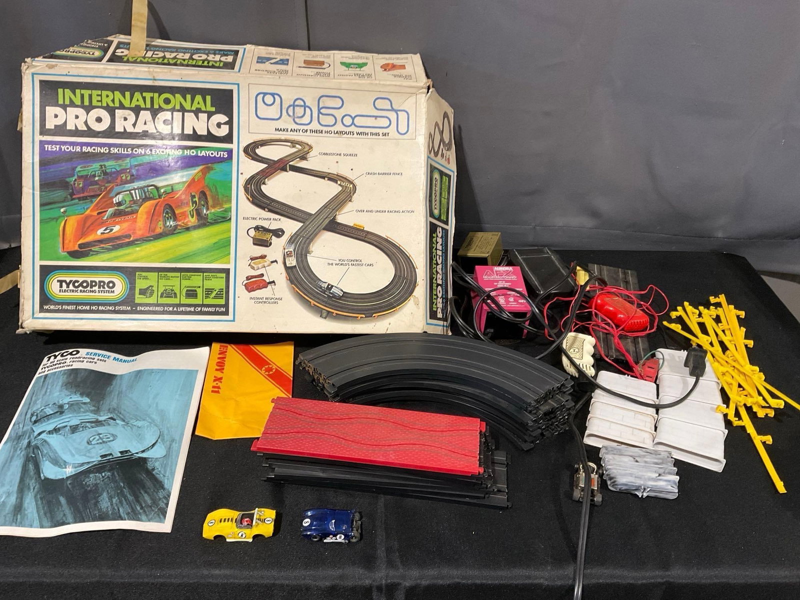 TycoPro International Pro Racing Track Slot Cars, w/original box, transformer, track, manual & more: Appears to be in fair to good shape. The piece measures approx 9h x 21w x 14d inches. See pics. E-6300