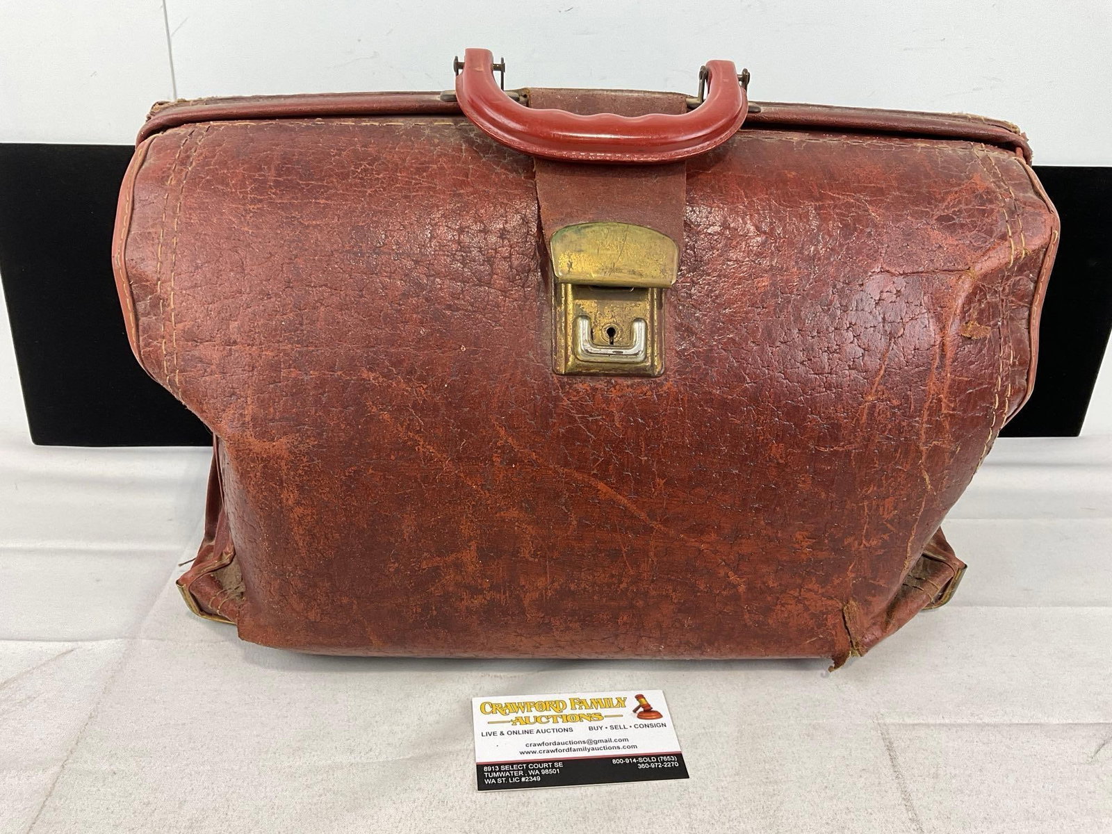 Vintage Leather Doctors Bag, 11h x 17w x 8d inches, w/FOE club pins & card: Appears to be in fair shape, the leather is cracked in several places. The piece measures approx 11h x 17w x 8d inches. See pics. E-6300