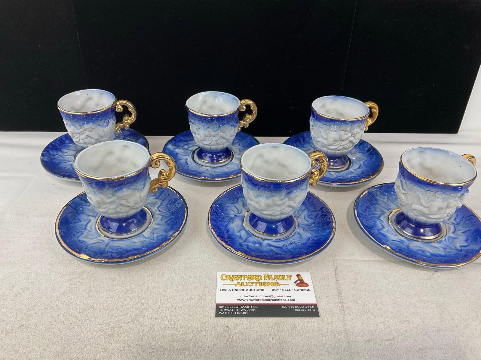 6 Porcelain Demitasse Cups & Saucers, Cobalt Blue & White w/Gilt Details: Appears to be in good shape. The piece measures approx 6h x 10w x 8d inches. See pics. E-6510