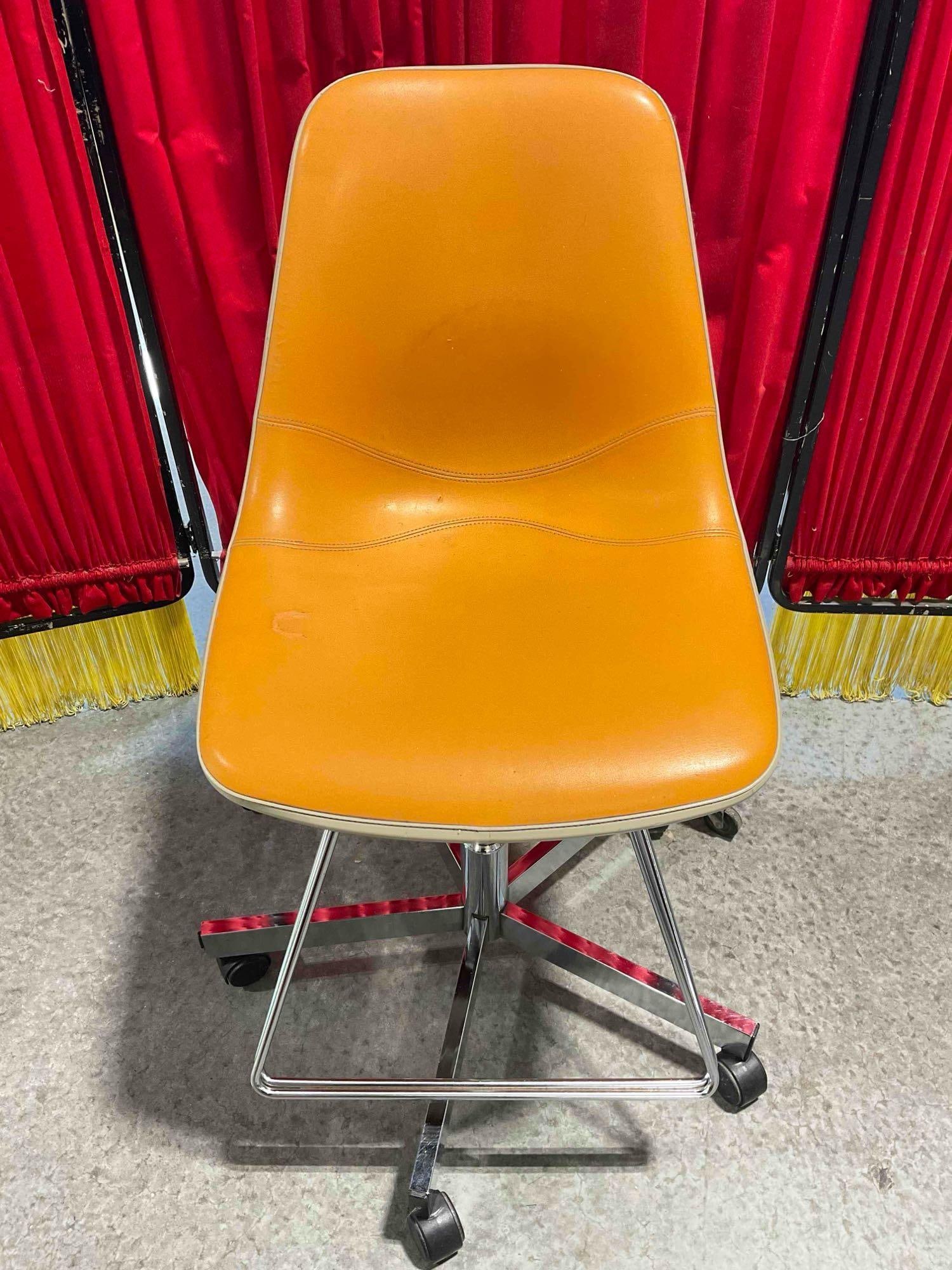Vintage Eames Style Shell Chair w/ Orange Vinyl Upholstery & Adjustable Height Chrome Base.: Vintage Eames Style Shell Chair w/ Orange Vinyl Upholstery & Adjustable Height Chrome Base. Composite chair seat w/ vinyl cushioning. No hallmarks, unsure if it is an Eames or just in the same sty