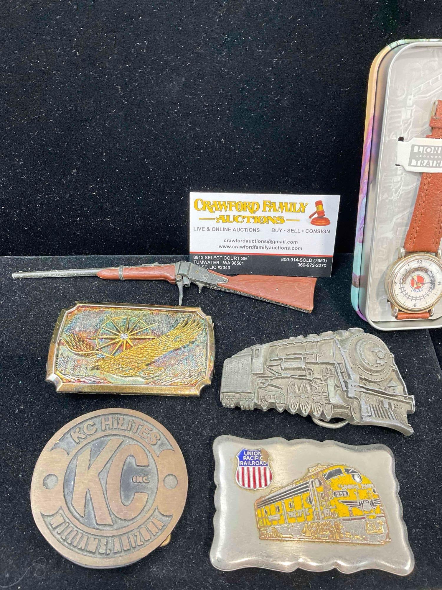 Lionel Train watch, 5x Belt Buckles, incl. Railroad, trucking & eagle themed & 2x Small Toys. - 2