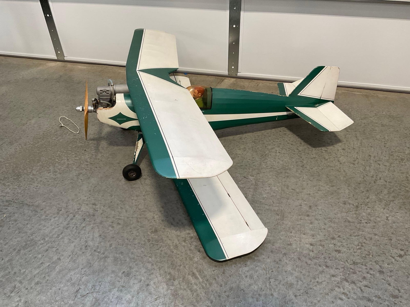Rare Vintage RC Bi-Plane, Green & White w/Vintage Super Tigre Engine: The plane models included engines that were working 1+ years ago. All from the same collection. Appears to be in good shape. The piece measures approx 52h x 25w x 17d inches. See pics.