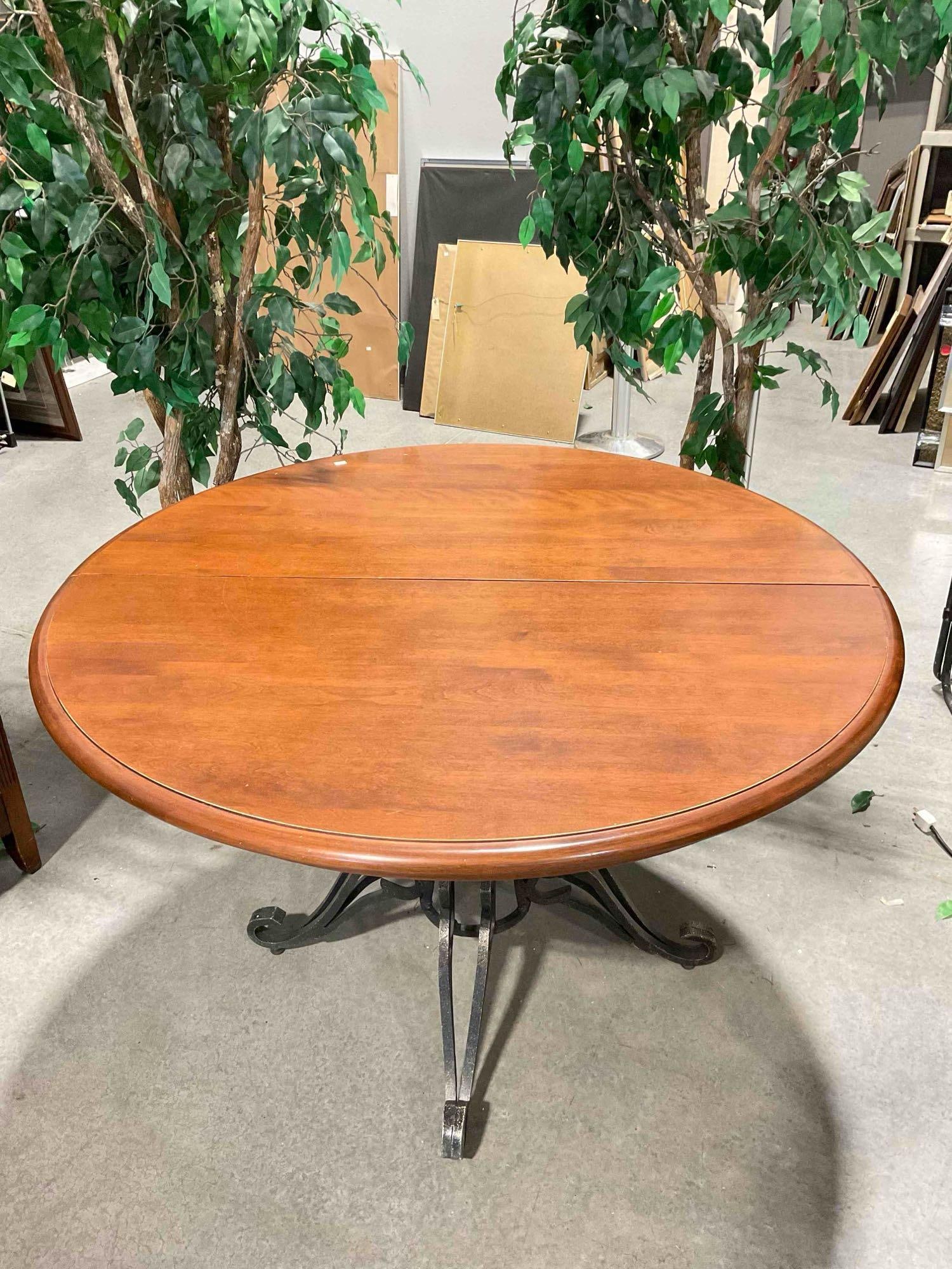 Modern Cherry Wood Top Expanding Dining Room Table (No Leaves) & Black Metal Base. See pics.: Modern Cherry Wood Top Expanding Dining Room Table (No Leaves) & Black Metal Base. Has space for leaves but includes no leaves. Piece has minor wear indicative of age and use, otherwise looks to