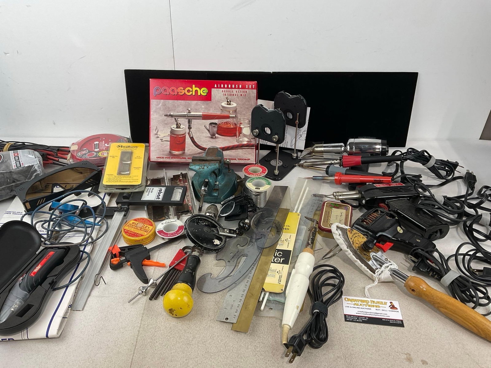 Assorted Hobby Supplies, Paasche Airbrush set w/box, Soldering Irons, Hand Drills, Stencils & more: Appears to be in good shape. The piece measures approx 18h x 19w x 19d inches. See pics. E-6260