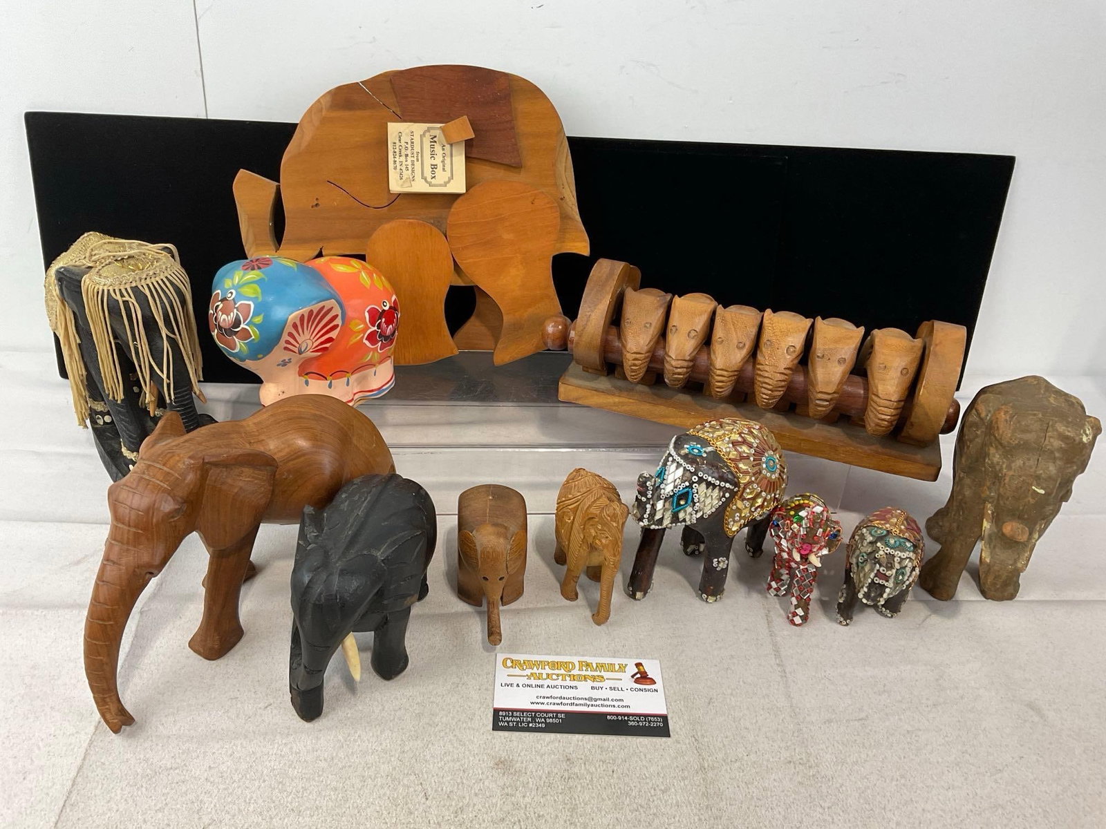 Elephant Shaped Wooden Carved Napkin Rings, Music Box, Figurines, Russian Painted Ceramic Figure: Appears to be in good shape. The piece measures approx 9h x 13w x 13d inches. See pics. E-6230