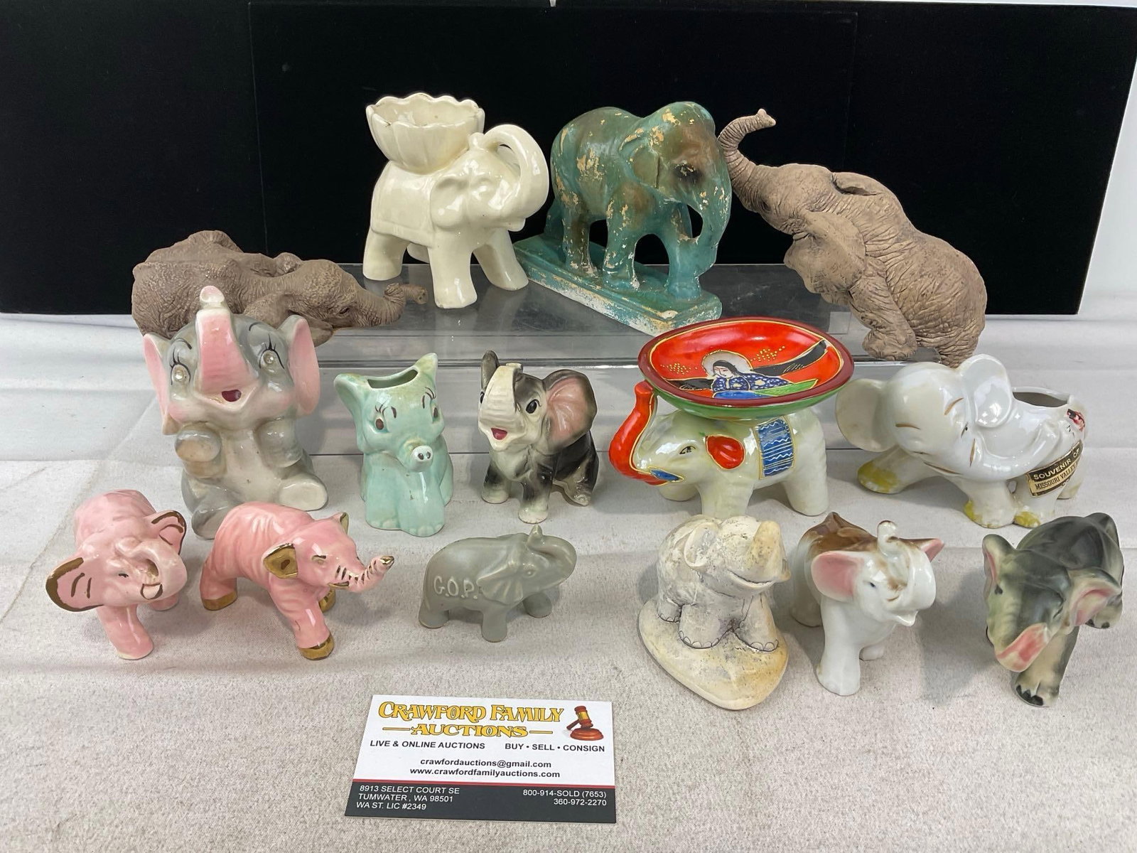 15 Elephant Shaped Figures, Glazed Ceramic, GOP, Pink Elephants, Composite, & more: Appears to be in good shape. The piece measures approx 6h x 13w x 13d inches. See pics. E-6230
