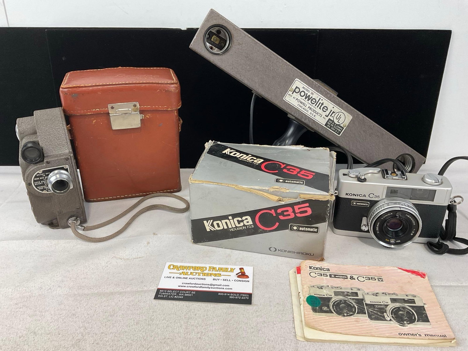 Revere Eight Model 88 Film Camera, w/case, Konica C35 Camera, & Powelite Jr. Model 20 Flash Module: Appears to be in good shape. The piece measures approx 11h x 13w x 9d inches. See pics. E-6400