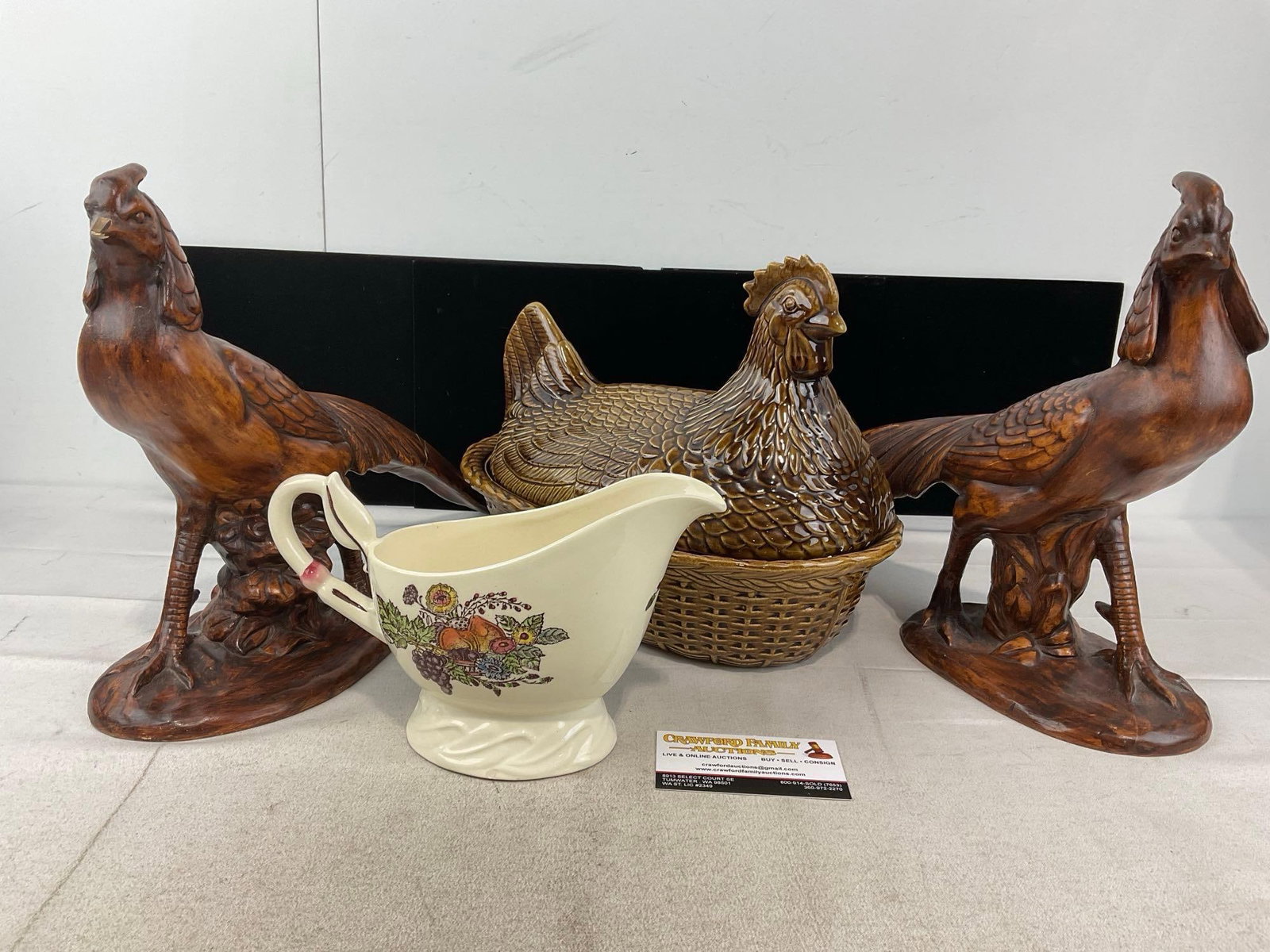 Pair of Ceramic Pheasant Figures, previously repaired, Hen Shaped Lidded Bowl, & Gravy Pitcher: Appears to be in fair to good shape, the pheasant figures look to be cracked and previously repaired, one is missing a portion of the tail plumage. The piece measures approx 12h x 20w x 16d inches.