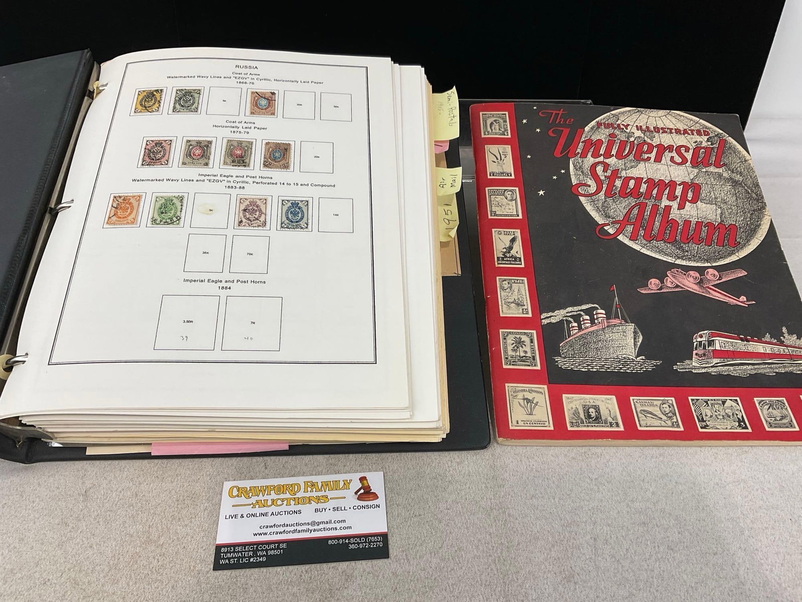Large Album w/stamps from Russia, some from ~1866 to 1960s, & Universal Stamp Album: The large album has some stamps from mid 17th century to 1960s. Appears to be in good shape. The piece measures approx 3h x 12w x 12d inches. See pics. E-6230