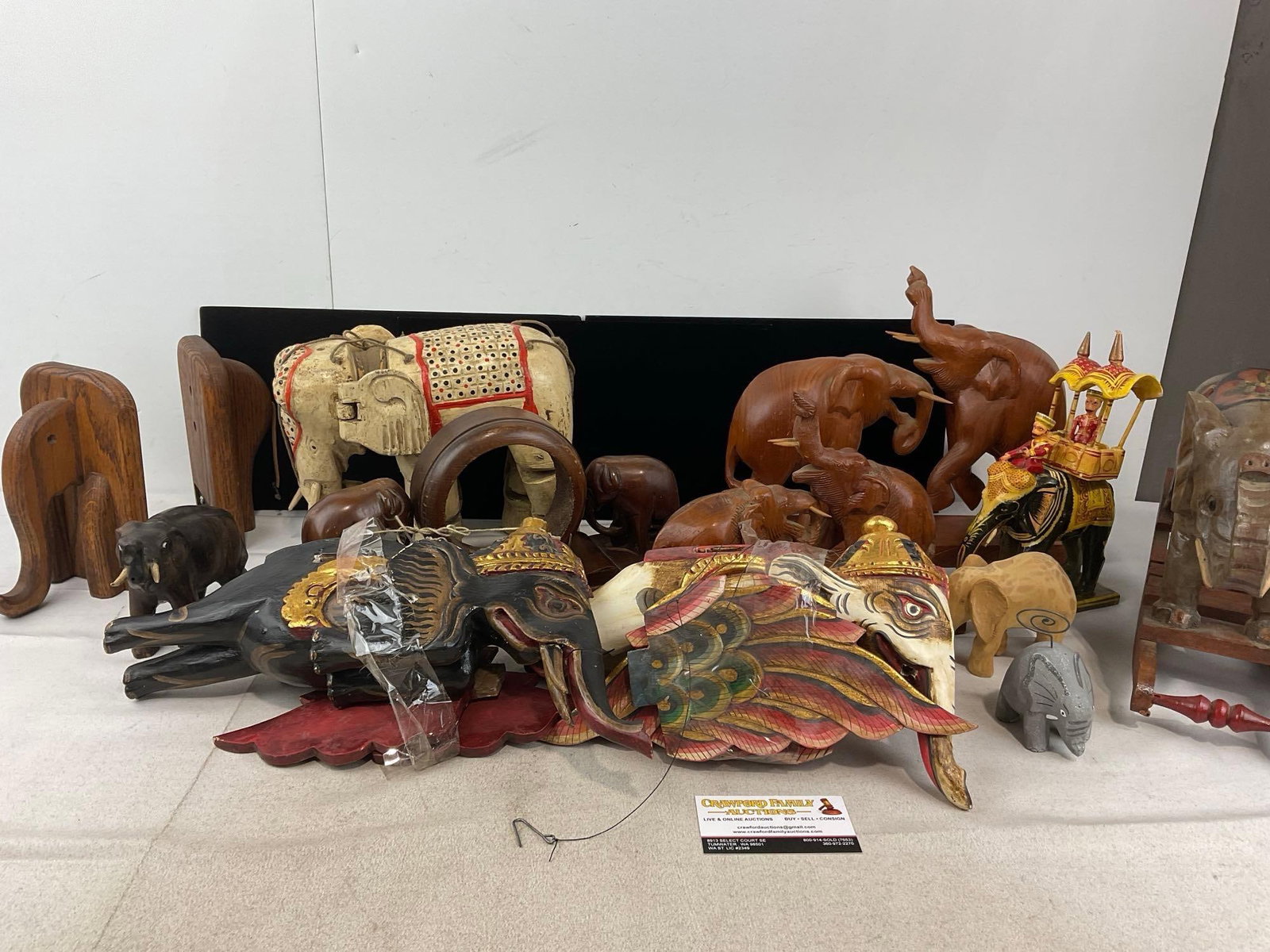 Assorted Elephant Carved Wooden Figures, Balinesian style Puppers, Thai style w/rider & Rocking Toy: Appears to be in good shape. The piece measures approx 14h x 23w x 17d inches. See pics. E-6230