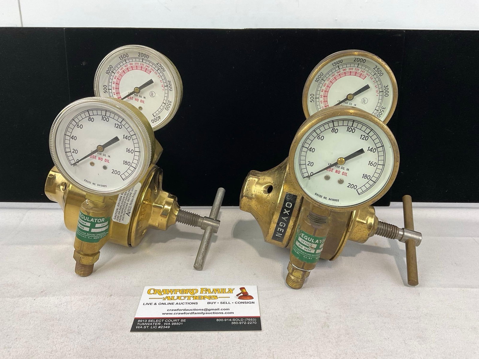 Pair of Cast Brass Heavy-Duty Single-Stage Oxygen/Gas Pressure Regulators: Appears to be in good shape. The piece measures approx 7h x 13w x 9d inches. See pics. E-6300