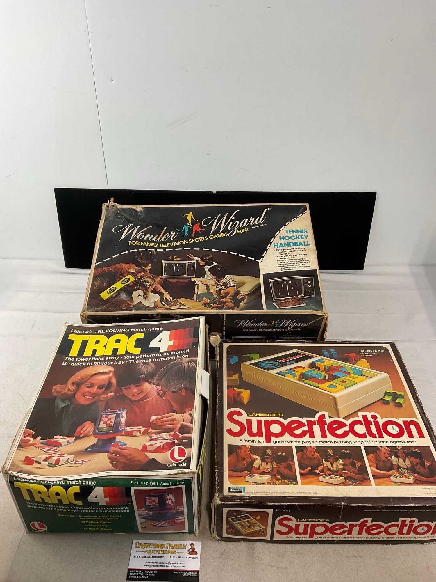 3 Vintage Games, Wonder Wizard TV game system, Trac 4, & Superfection Pattern board games: Appears to be in good shape. The piece measures approx 15h x 13w x 17d inches. See pics. E-6300