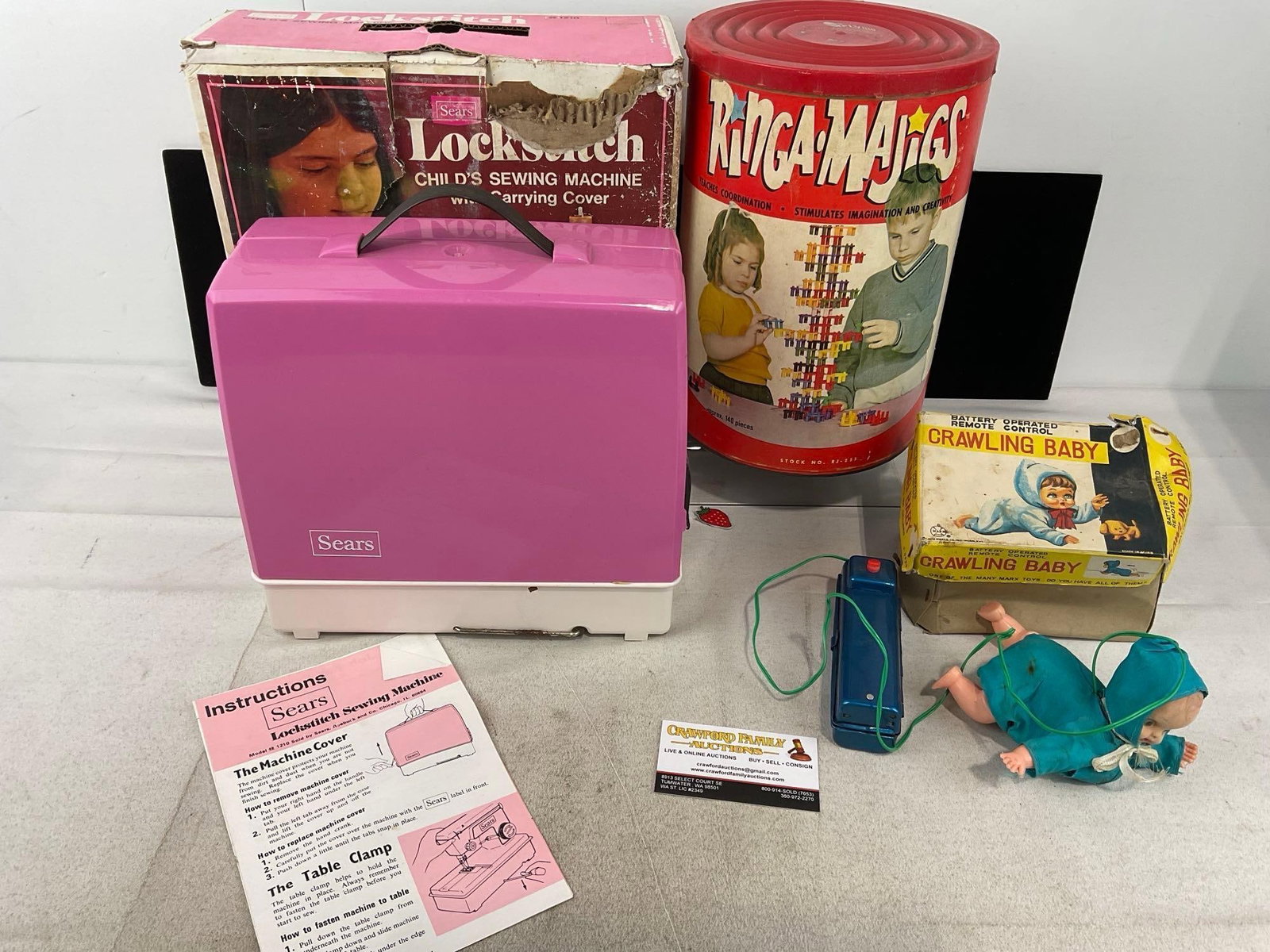 Sears Lockstitch Childs Sewing Machine, RingaMajigs w/cylinder box, Marx Crawling Baby w/remote Toy: Appears to be in good shape. The piece measures approx 13h x 12w x 12d inches. See pics. E-6300