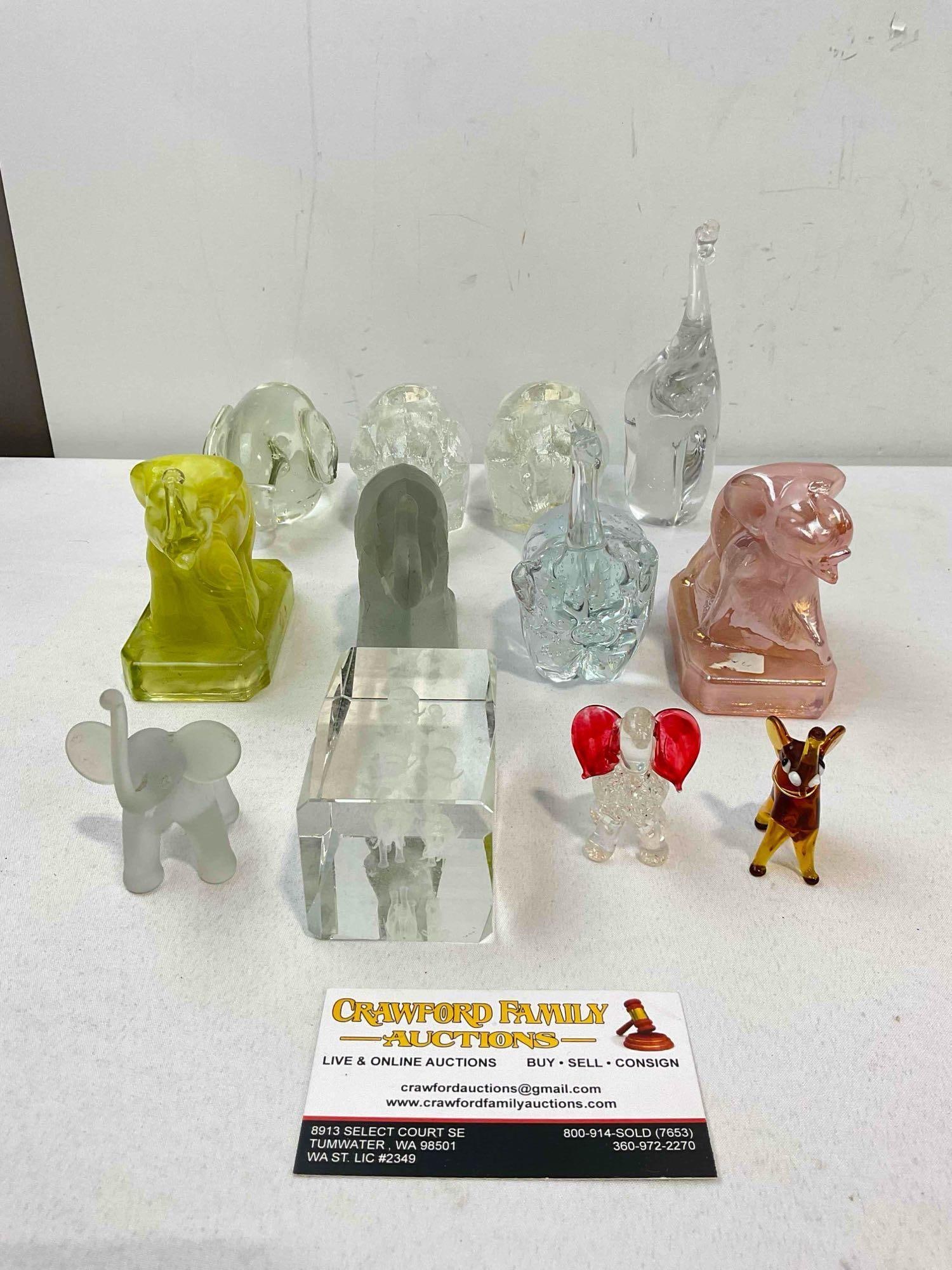 12 pcs Glass Elephant Figurines & Paperweights, incl. 2x Vintage Boyd "Zack the Elephant.": 12 pcs Glass Elephant Figurines & Paperweights, incl. 2x Vintage Boyd "Zack the Elephant." Glass block has a chipped in it, otherwise look to be in good condition. Fit in a box measuring 11" x 9"