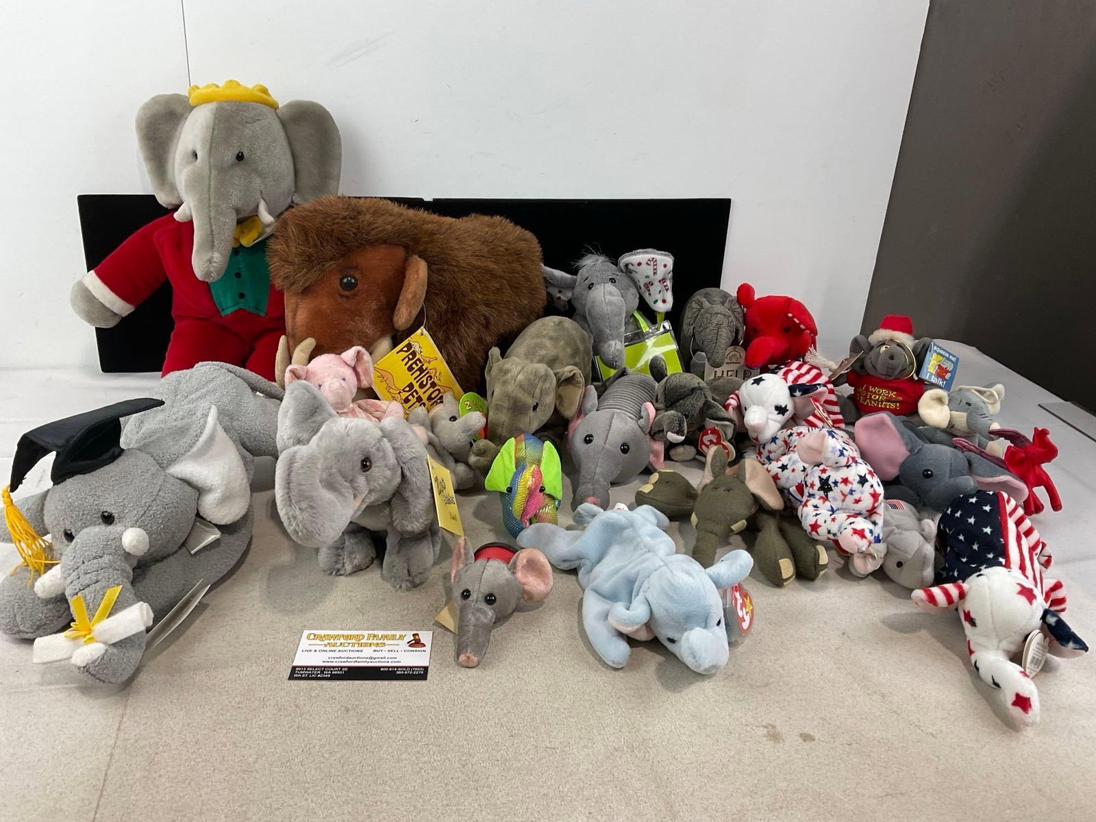 Collection of Elephant Plushes, Babar, Mammoth, Several Ty Beanie Babies, & more, approx 25 pieces: Appears to be in good shape. The piece measures approx 12h x 23w x 16d inches. See pics. E-6230