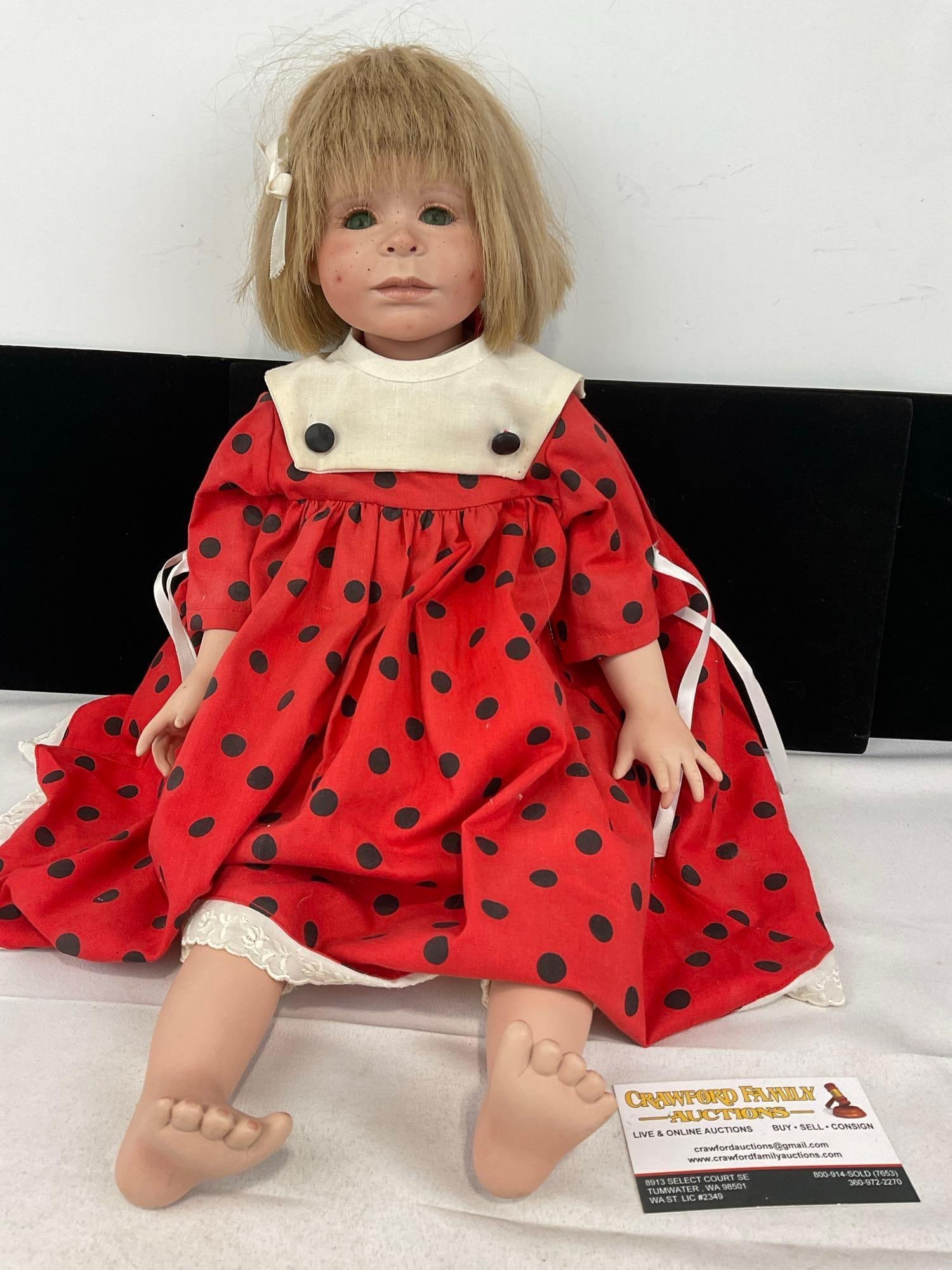Antique Porcelain Girl Doll, Blonde Red Dress w/ Black Dots, 23h x 8w x 6d inches: The doll is marked on the back of the neck, looks like Tula 1/10-91 A.B. Appears to be in good shape. The piece measures approx 23h x 8w x 6d inches. See pics. E-5520