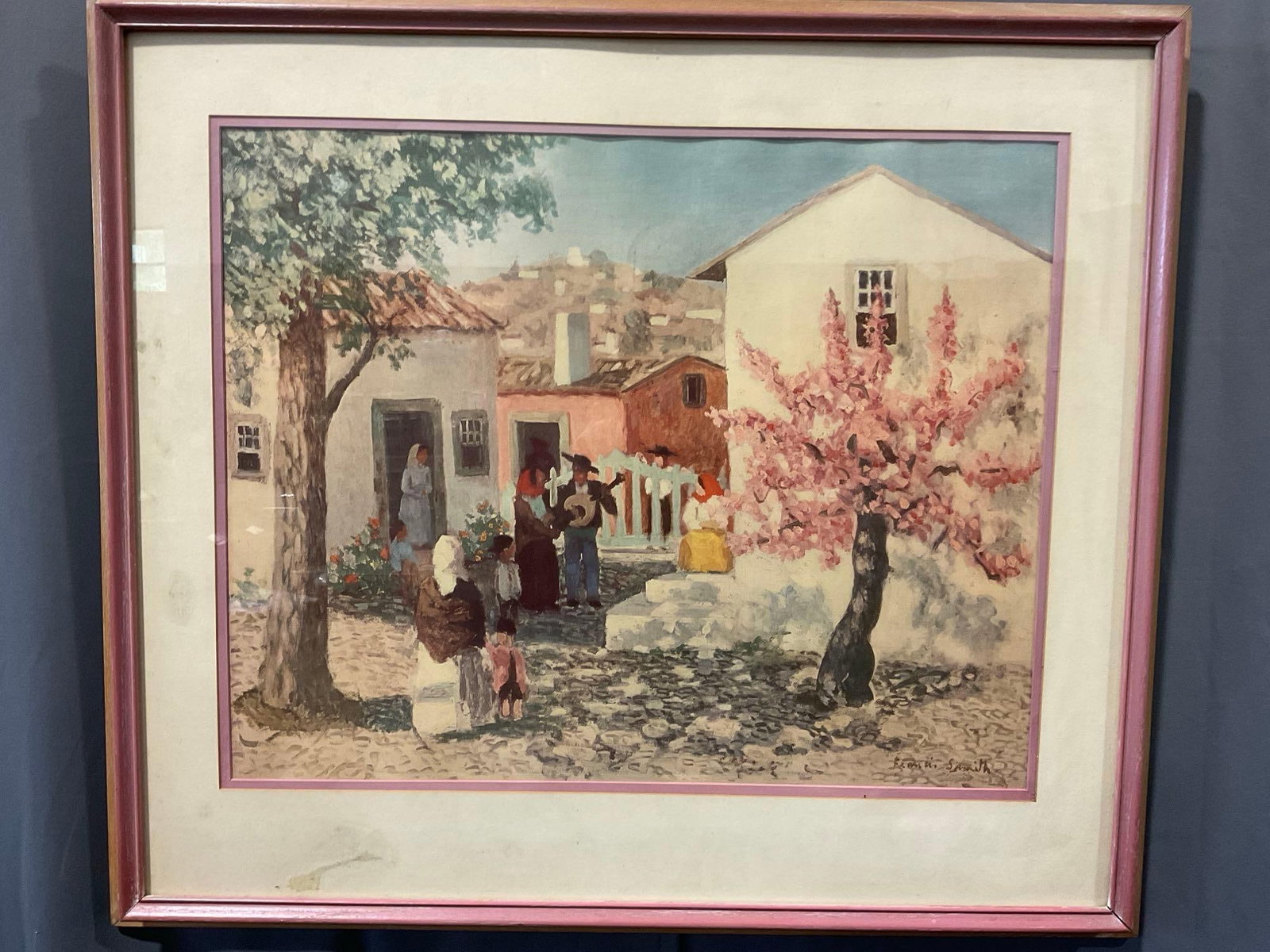 Framed Litho titled Portuguese Village - The Guitarist by F. Smith, 27h x 30w x 3d inches: Appears to be in good shape. The piece measures approx 27h x 30w x 3d inches. See pics. E-5520