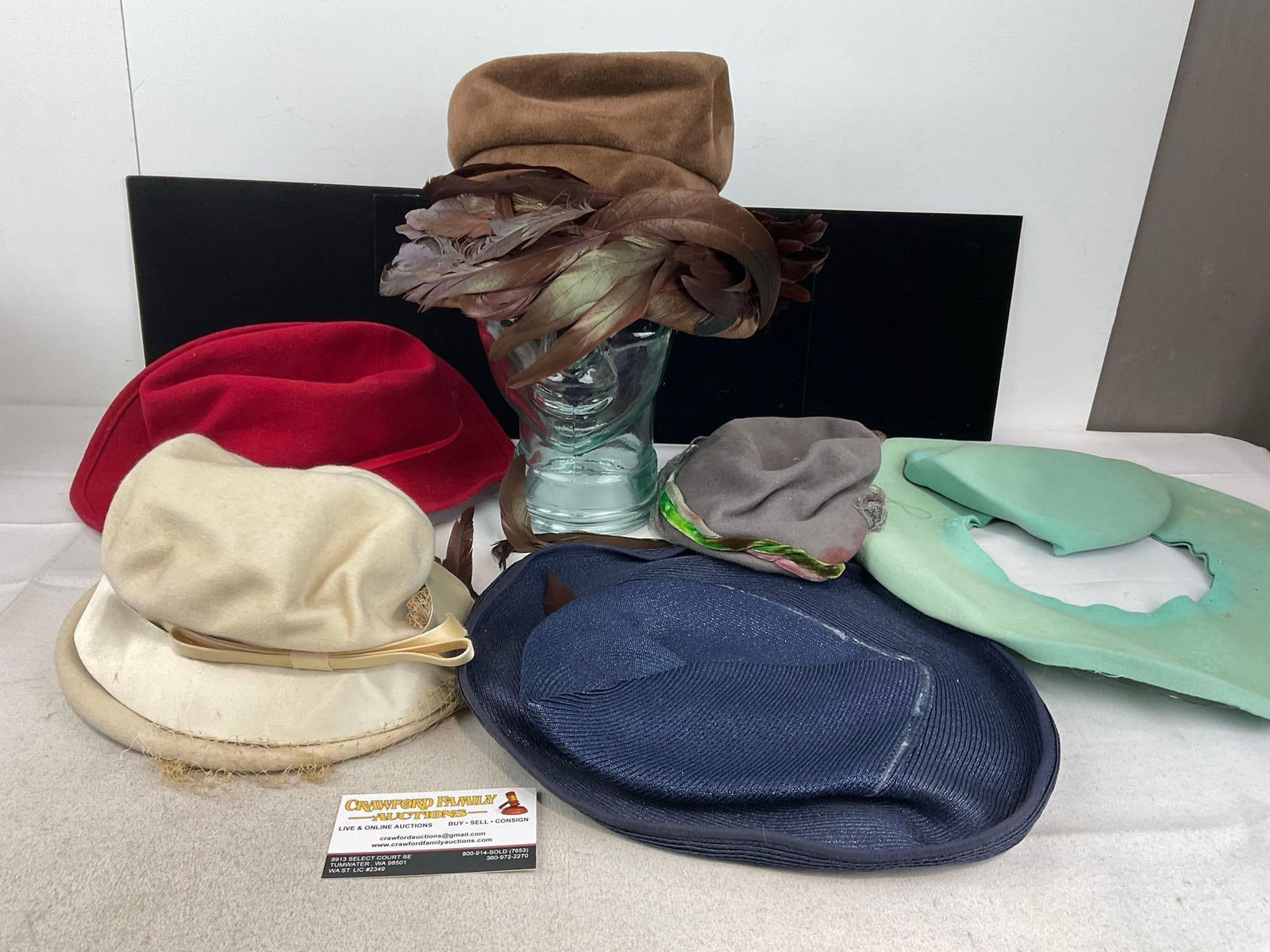 Collection of 6 Hats, Pheasant Feather Bucket Hat, Pale Blue Fedora, Cloche Style & more: Appears to be in fair to good shape, one hat has come apart. The piece measures approx 9h x 13w x 13d inches. See pics. E-6160