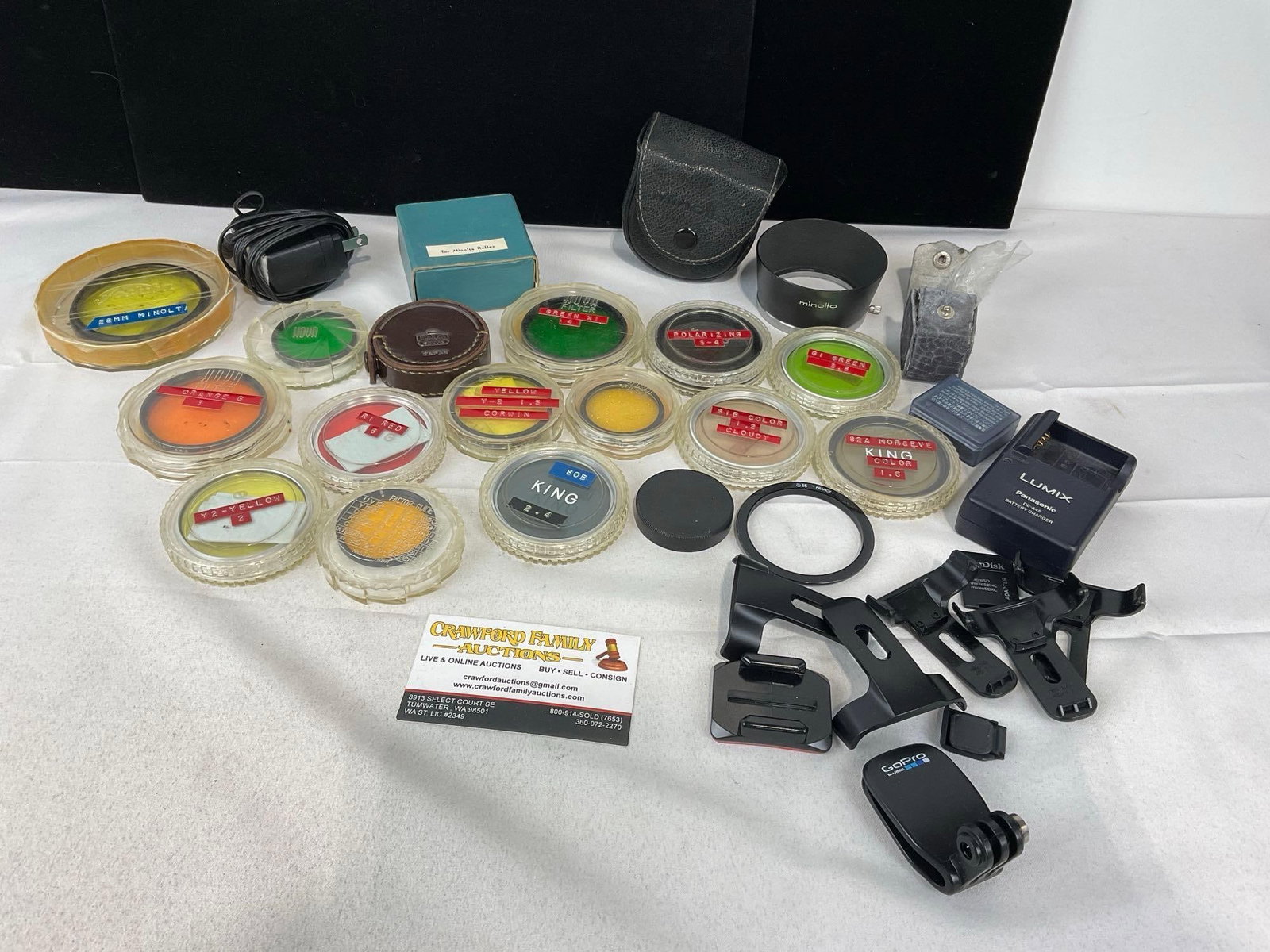 Camera Accessories, largely Filters, 15 pieces, Lumix battery & charger: Appears to be in good shape. The piece measures approx 8h x 10w x 5d inches. See pics. E-414