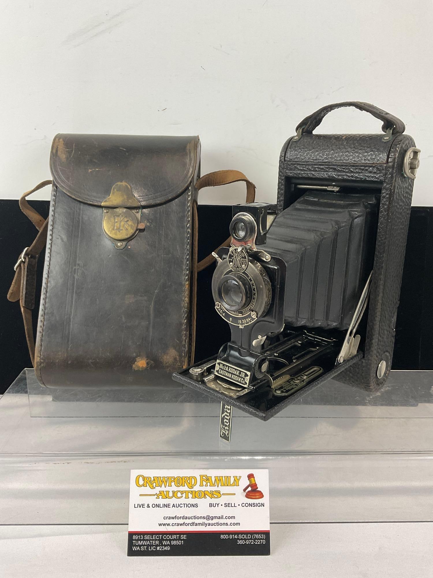 Early 20th Century Camera by Eastman Kodak Co. No.1-A Kodak Jr, 10x6x4 inches, w/leather case: Appears to be in good shape, some wear can be seen. The piece measures approx 10h x 6w x 4d inches. See pics. E-6610