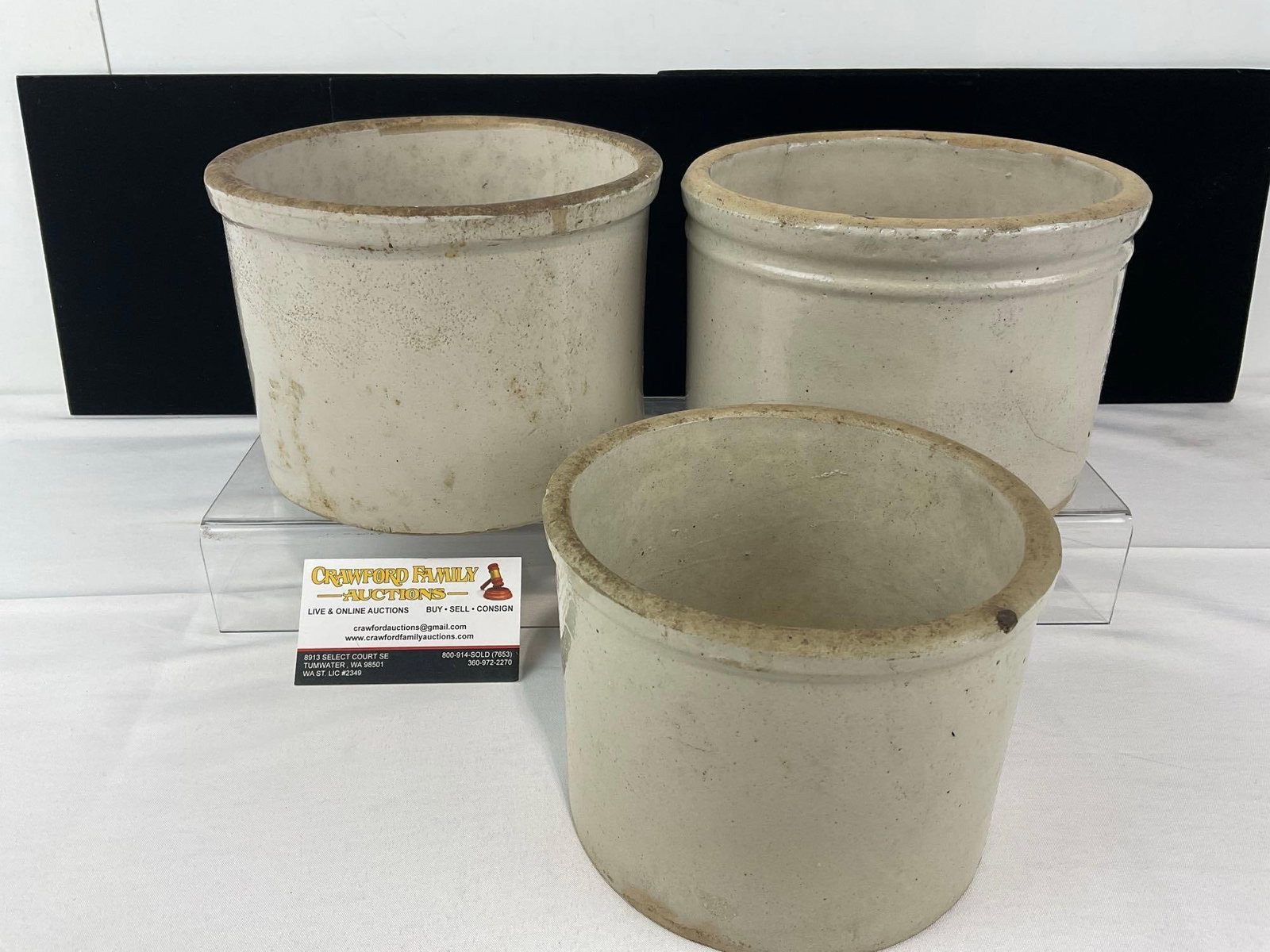 3 Stoneware White Glazed Crocks, 2 8 inch, 1 smaller 6 inch: Two appear to be in good shape, the other larger piece is cracked through half of the bottom. The pieces together measures approx 12h x 8w x 8d inches. See pics. E-6610