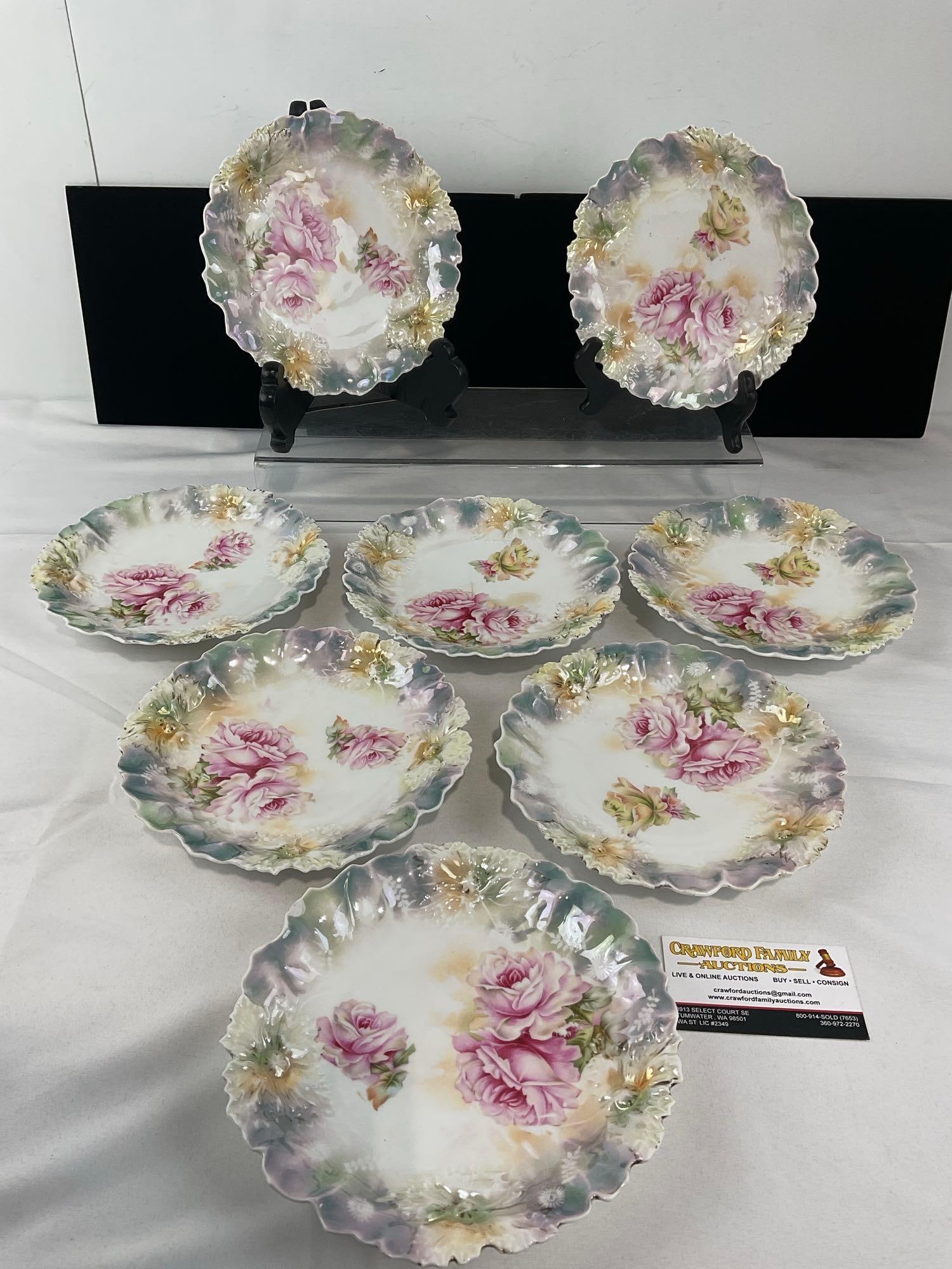 8 Antique Early 20th Century RS Prussia Plates, Handpainted Pink/White Roses, Scalloped Edges: Appears to be in good shape for the age, one has a thin crack through it, possibly . The piece measures approx 6h x 9w x 9d inches. See pics. E-6610