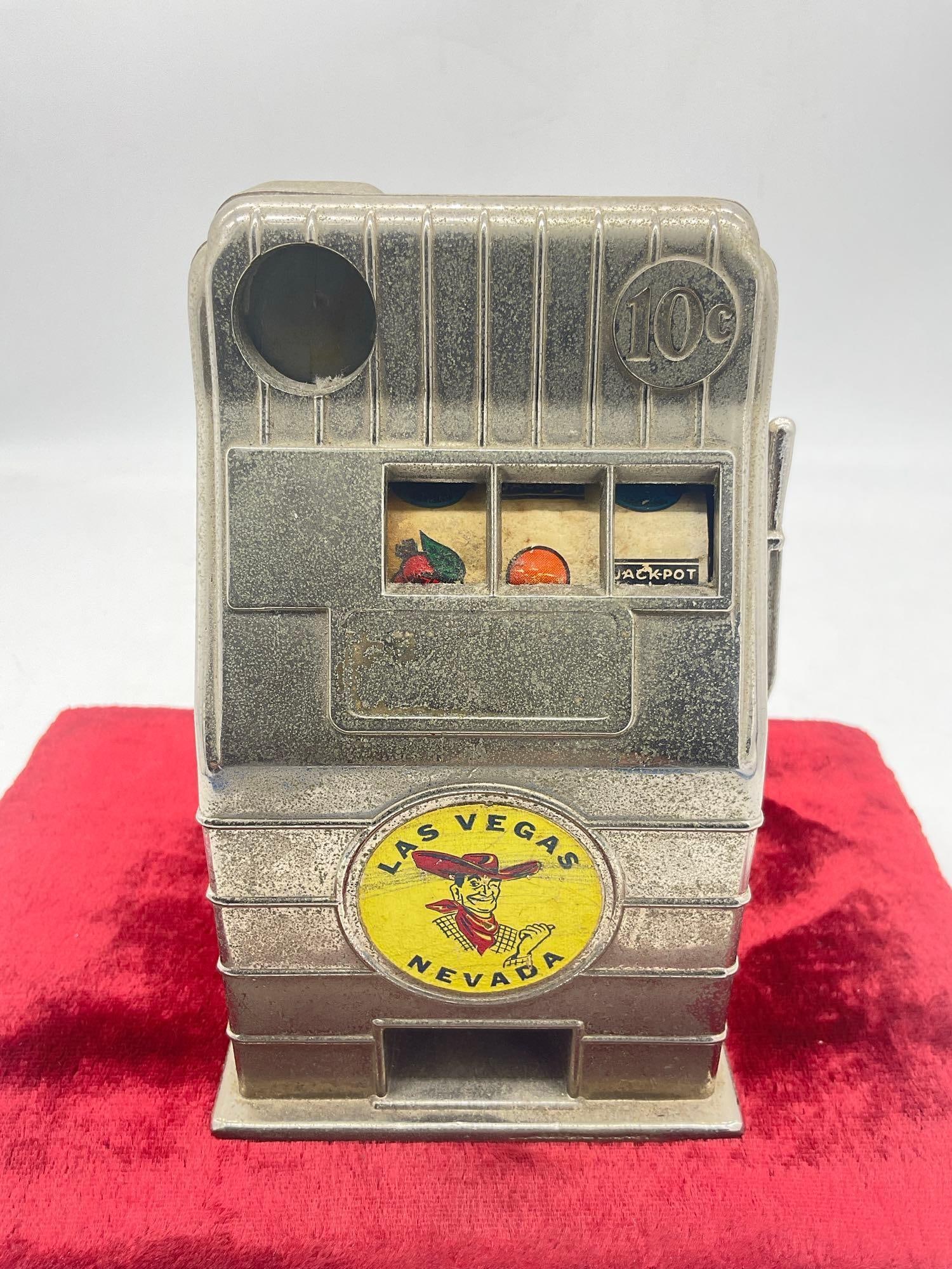 Circa 1950's / 60's Las Vegas Jack pot metal Mechanical toy 10 cent Slot machine coin bank: c-6300 Sold as is Reel free spins 6" x 3.5" 