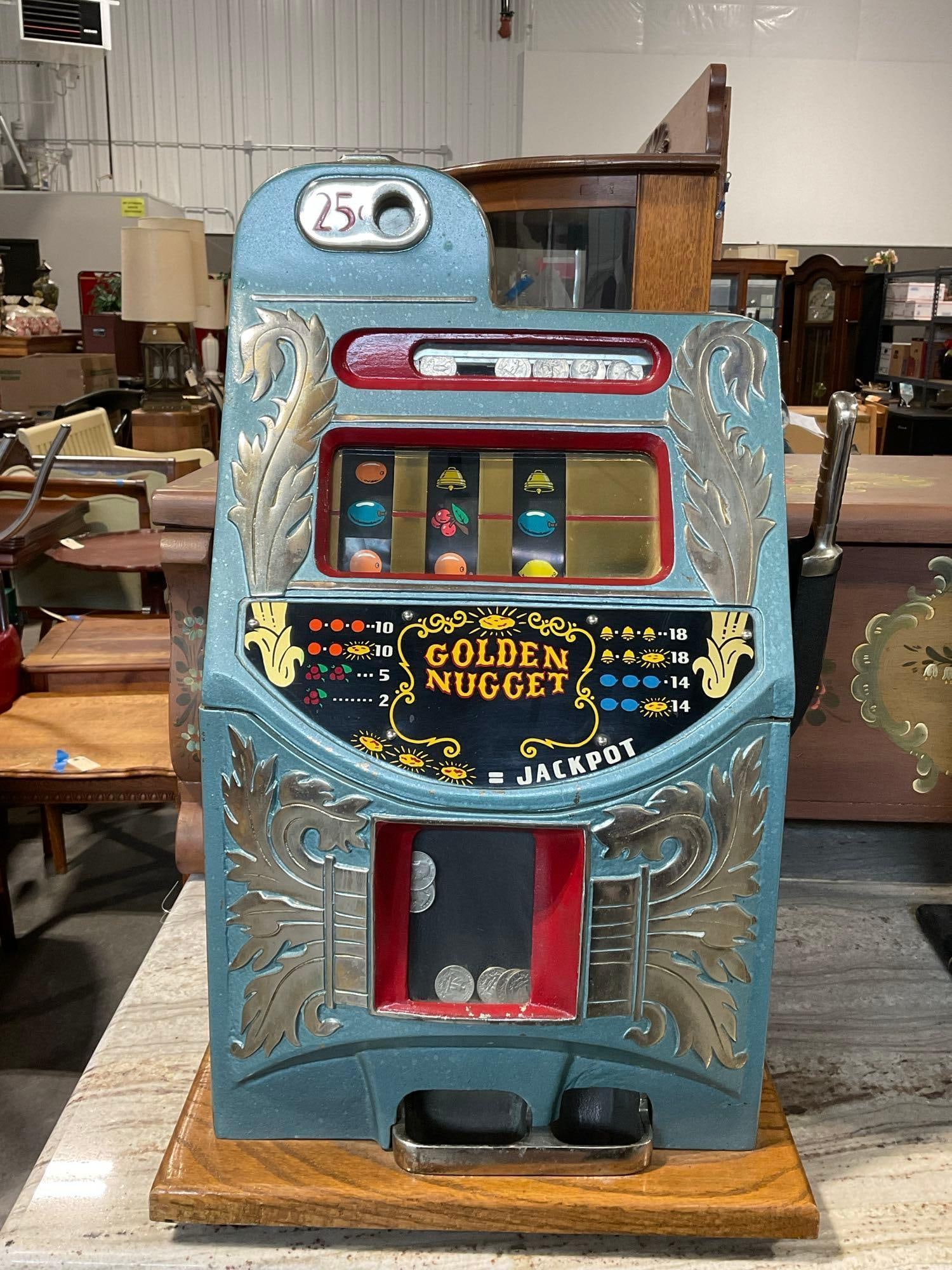 Vintage later 1940s Quarter 25 cent Mills Golden Nugget Mechanical Slot Machine, 27x18x16 inch: Aikens front Valued 1500-2500 Appears to be in good shape. Sold as -is may need maintenance, No Key The piece measures approx 27h x 18w x 16d inches. See pics. E-6590 *Freight