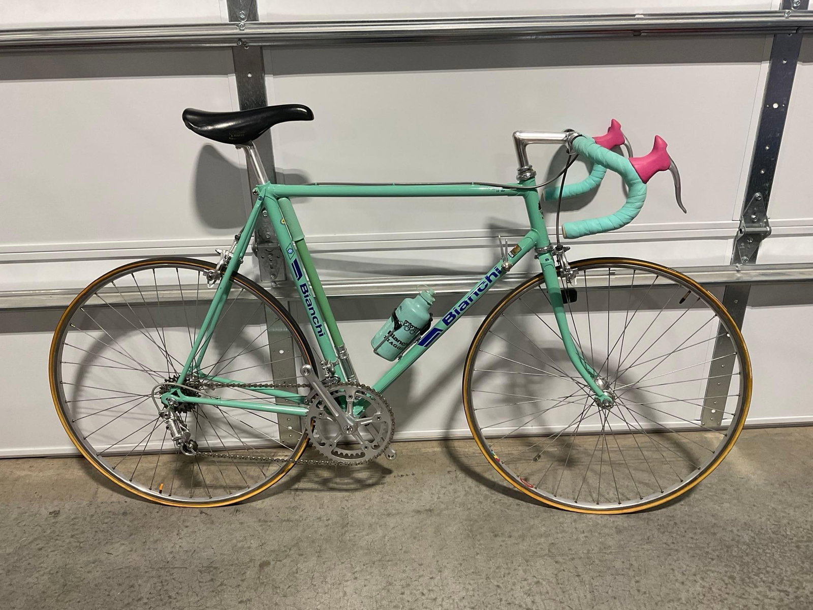 Vintage 80s Bianchi Celeste Mint Green Bicycle, w/Water Bottle, High End Road Bike w/Pink Handleb...: Valued at roughly 2000 dollars. No pedals included. Appears to be in good shape. The piece measures approx 39h x 64w x 18d inches. See pics. E-6600 *Freight Required if shipped, Buyer