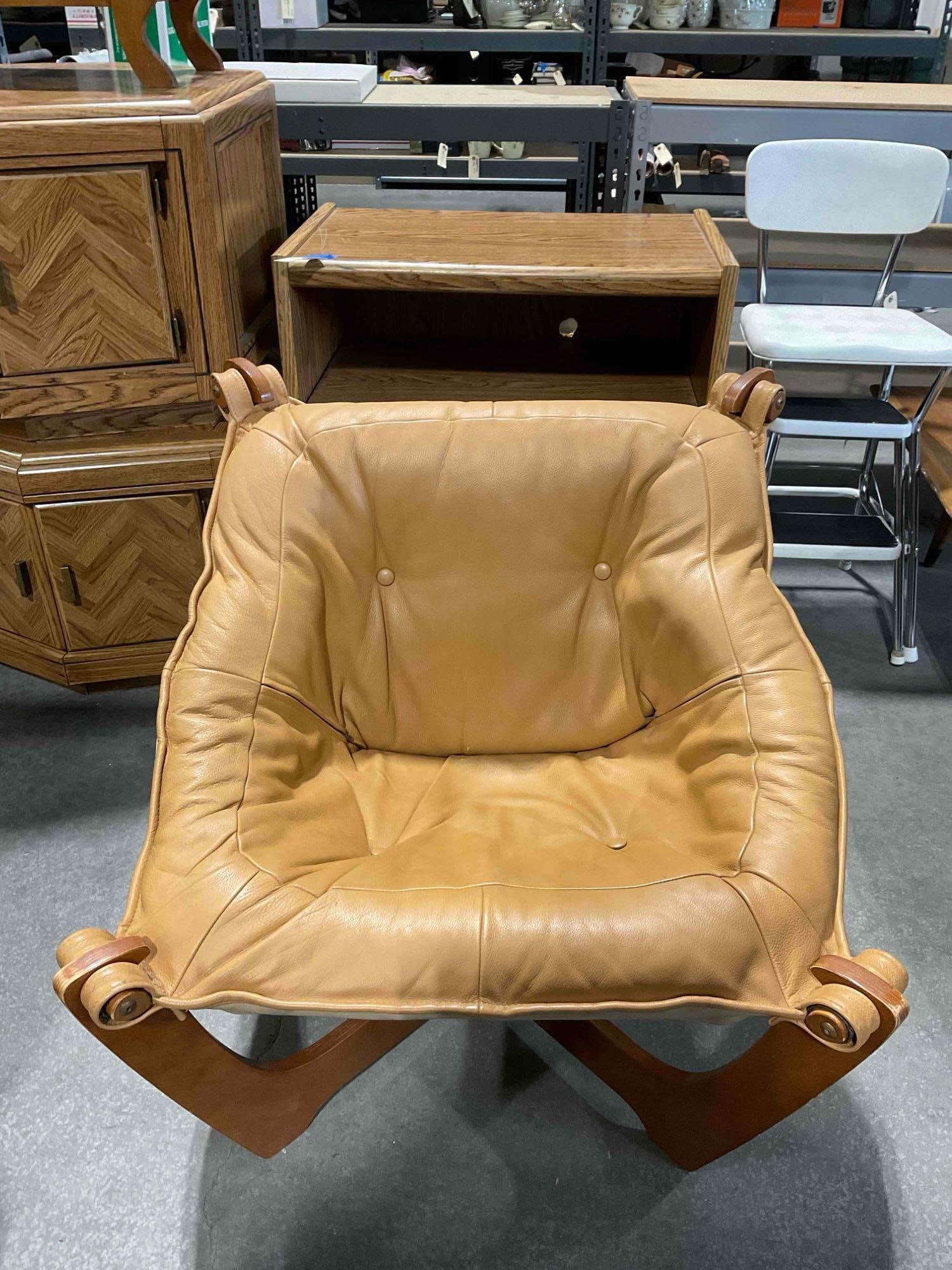 Vintage Luna Sling Lounge Chair by Hjellegjerde w/ Camel Leather Upholstery. Fair Condition.: Vintage Luna Sling Lounge Chair by Hjellegjerde w/ Camel Leather Upholstery. Fair Condition. One chair has lost its tag, but its twin (lot 256) has the original Hjellegjerde tag. look to be teak