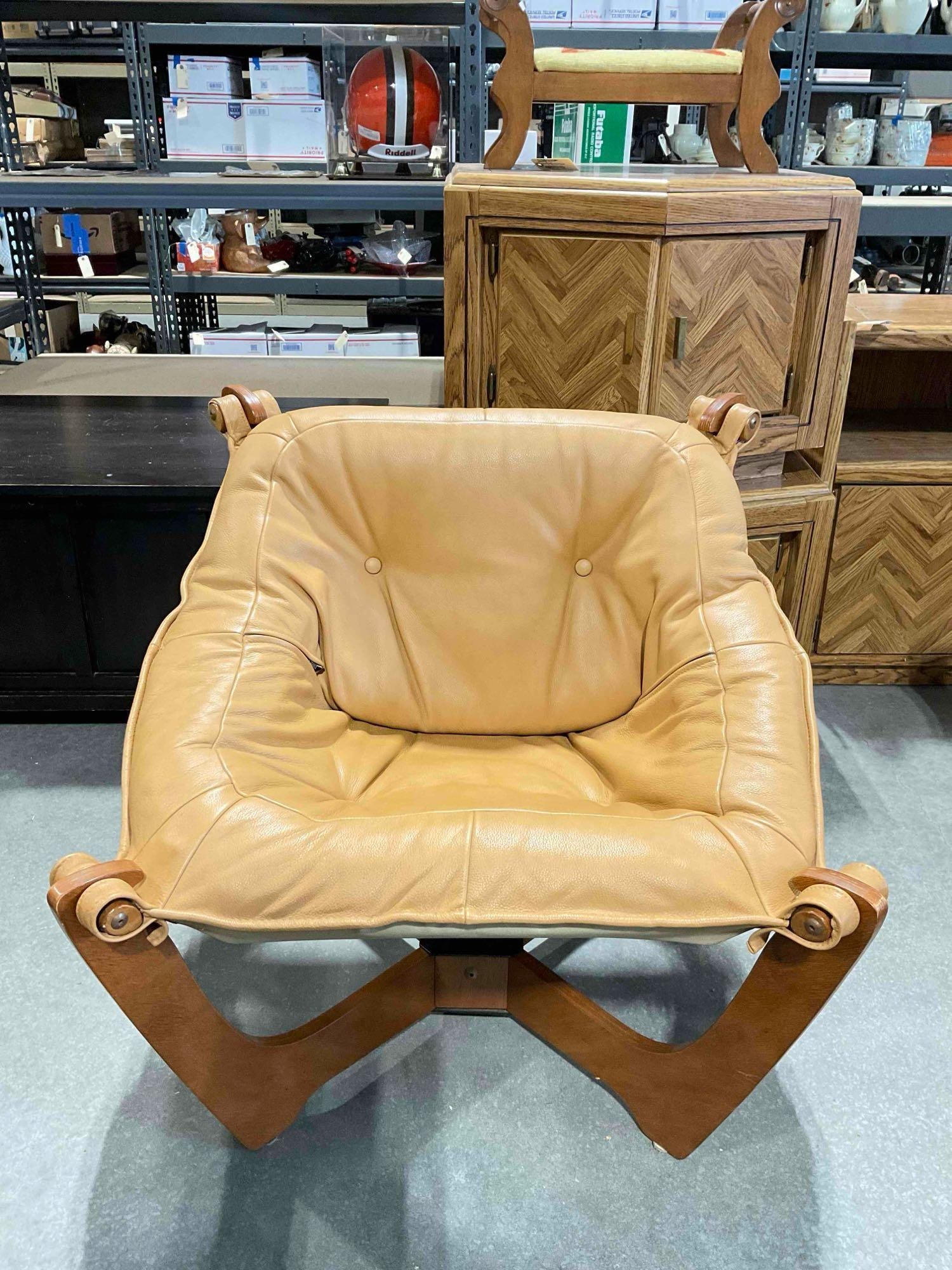 Vintage Luna Sling Lounge Chair by Hjellegjerde w/ Camel Leather Upholstery. Good Condition.: Vintage Luna Sling Lounge Chair by Hjellegjerde w/ Camel Leather Upholstery. Good Condition. Minor scrape to the back of one support, otherwise looks to be in good condition. Pair to lot 114.