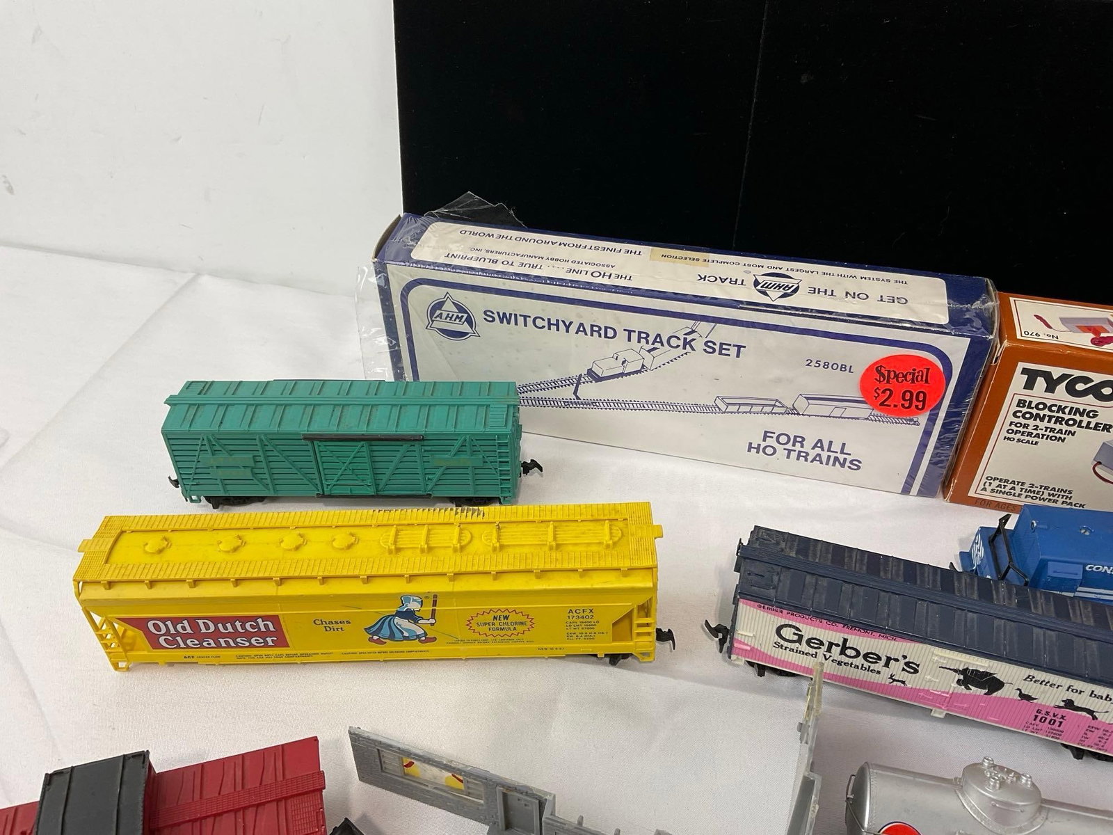 Collection of HO Scale Train Cars, Box Cars, Cabooses, small amount of Track, Switchyard Set & more - 3