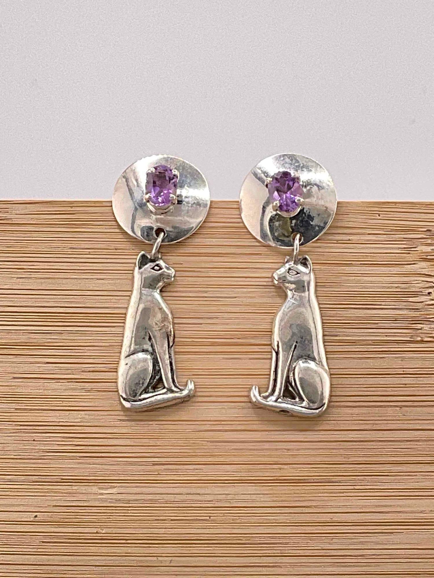 Vintage Carol Felley Sterling Silver Earrings w/ Cat Design & Amethyst Toned Settings. See pics.: Vintage Carol Felley Sterling Silver Earrings w/ Cat Design & Amethyst Toned Settings. Weighs 13 grams. Stamped 89. Rubber earring backs are for photography purposes only, Not Included. dm-414