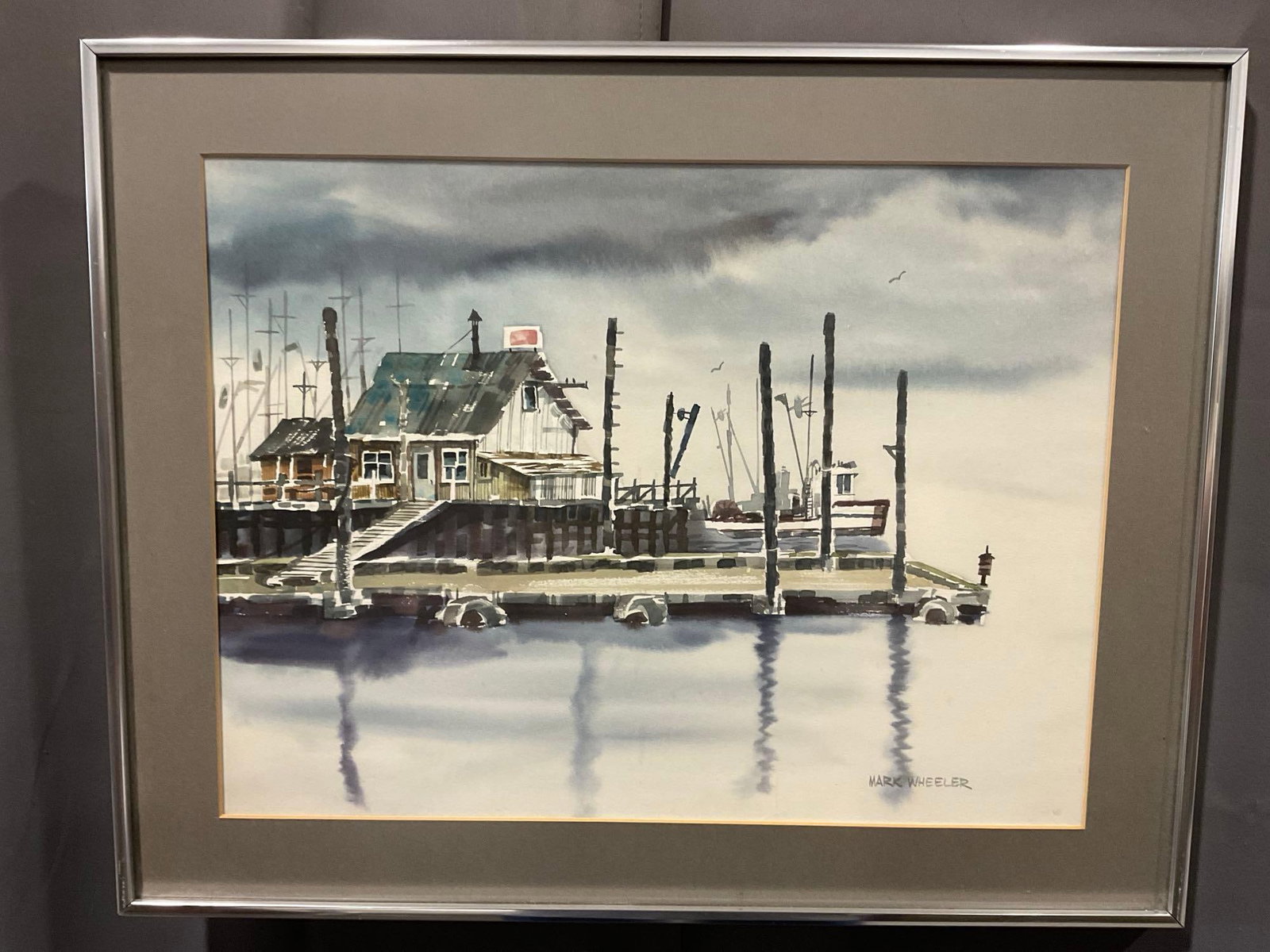 Framed Signed Original Watercolor on Board, Harbor Docks Scene by Mark Wheeler, 20x25 inches: Appears to be in good shape. The piece measures approx 20h x 25w x 3d inches. See pics. E-6610