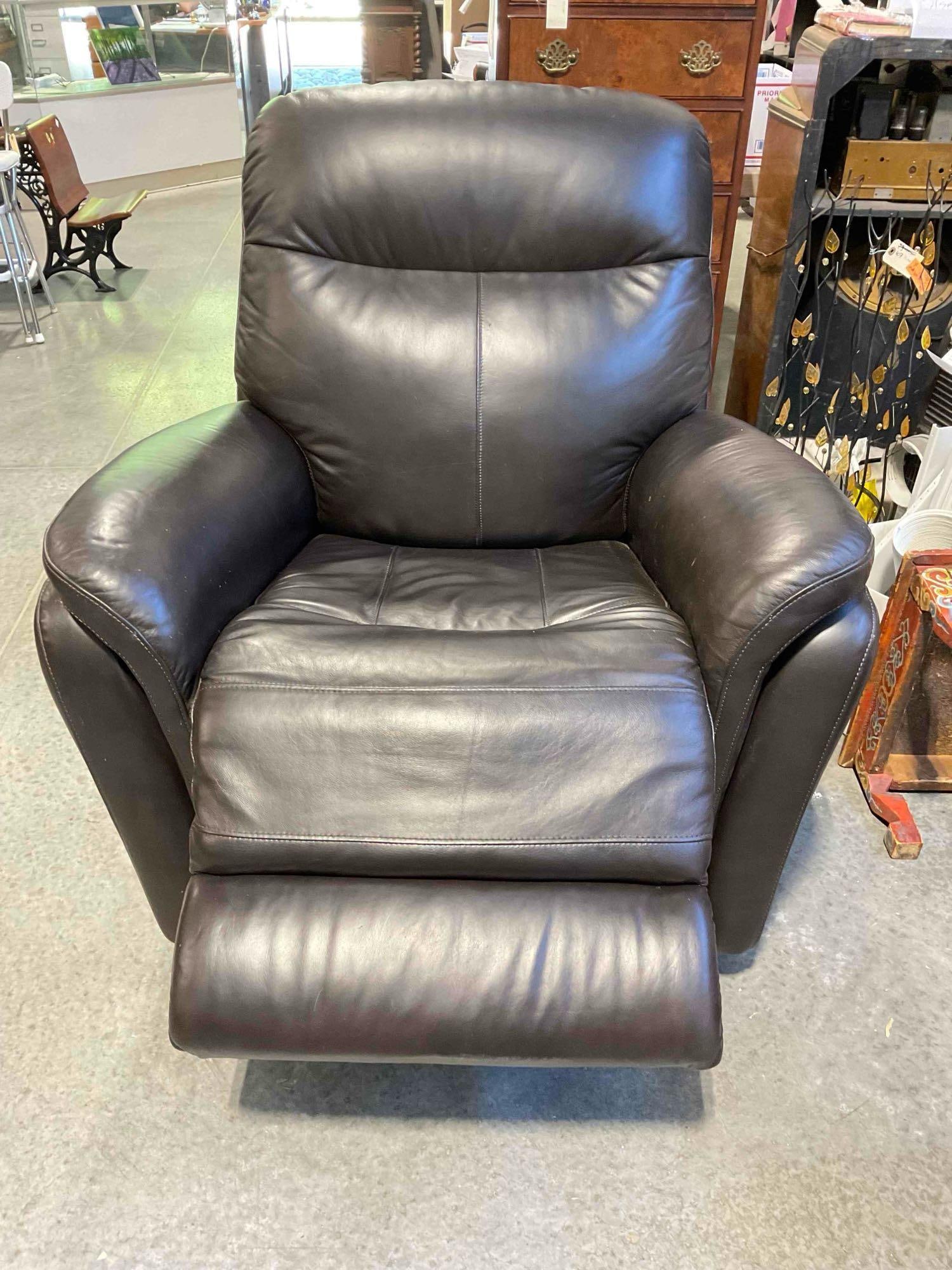 Leggett & Platt Espresso Brown Leather Power Recliner Rocking Chair. Tested, Works. Good Cond.: leggett & platt Espresso Brown Leather Power Recliner Rocking Chair. Tested, Works. Good Condition. Pair to lot 234. Minor wear indicative of age and use, otherwise looks to be in good condition.